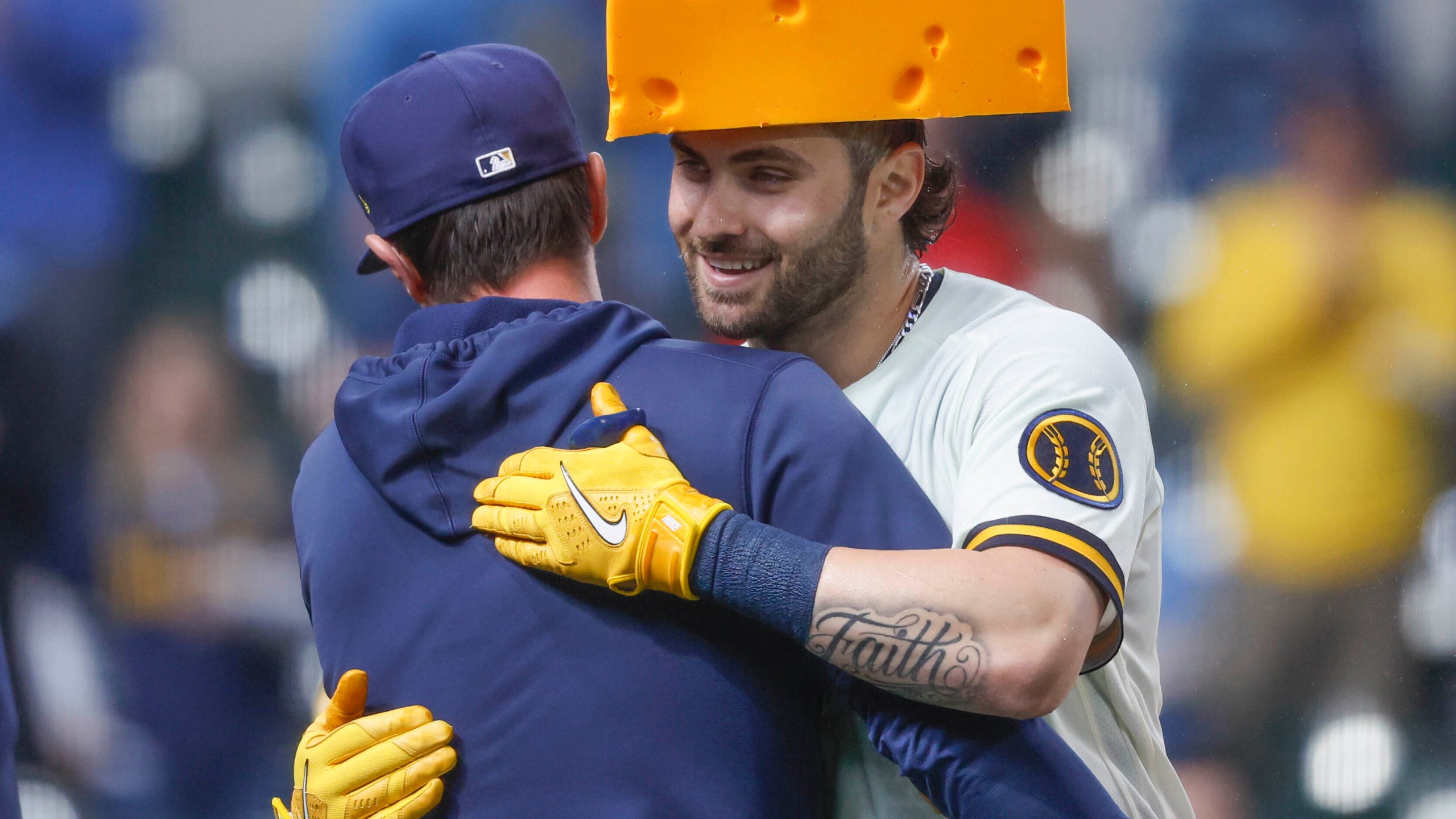 Milwaukee Brewers' Garrett Mitchell, right, is congratulated after hitting the game-winning home run during the ninth inning of a baseball game against the New York Mets Wednesday, April 5, 2023, in Milwaukee. The Brewers won 7-6. (AP Photo/Jeffrey Phelps)