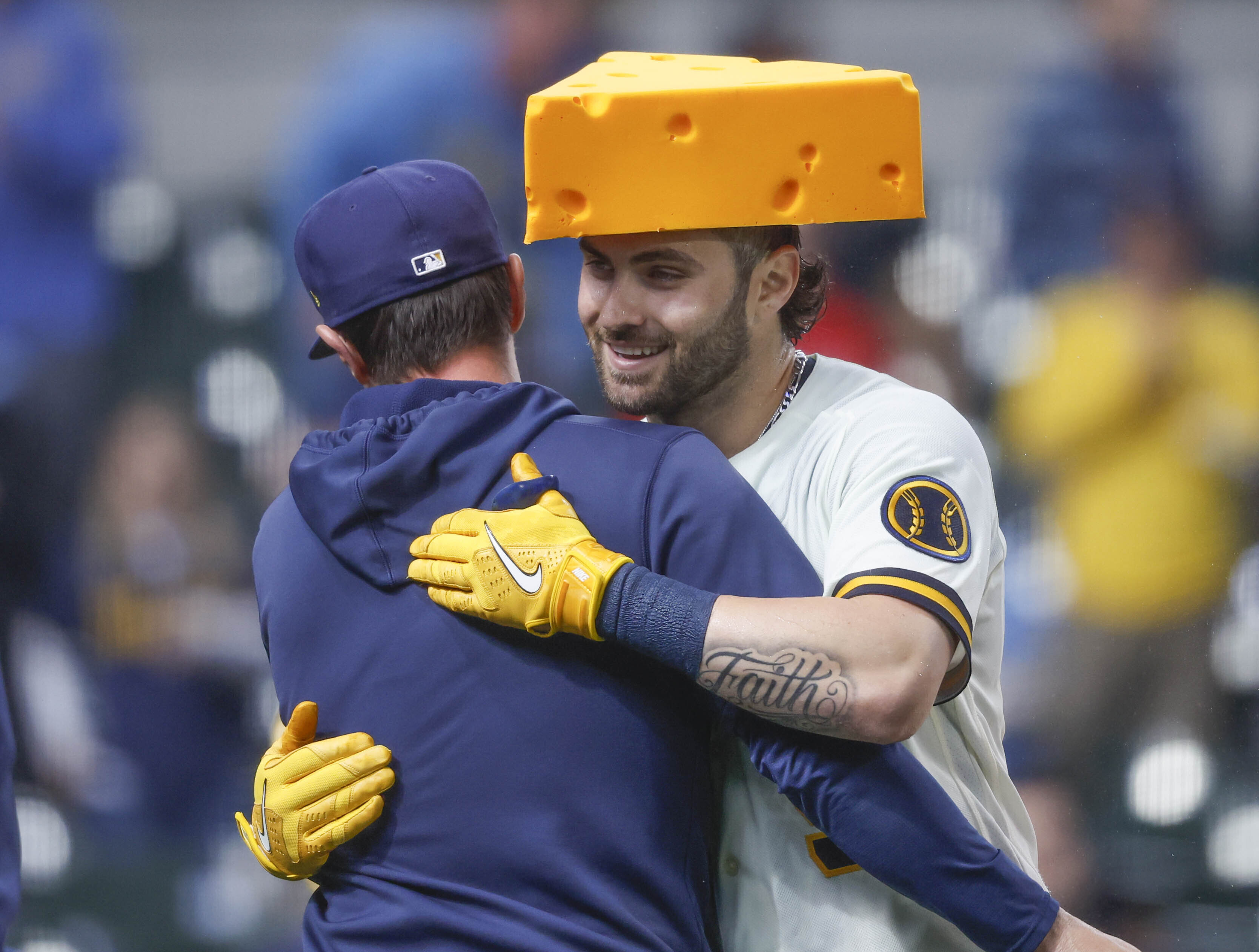 Milwaukee Brewers' Garrett Mitchell, right, is congratulated after hitting the game-winning home run during the ninth inning of a baseball game against the New York Mets Wednesday, April 5, 2023, in Milwaukee. The Brewers won 7-6. (AP Photo/Jeffrey Phelps)