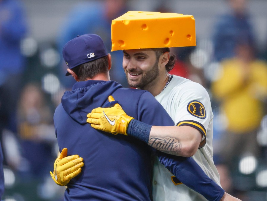 Milwaukee Brewers' Garrett Mitchell, right, is congratulated after hitting the game-winning home run during the ninth inning of a baseball game against the New York Mets Wednesday, April 5, 2023, in Milwaukee. The Brewers won 7-6. (AP Photo/Jeffrey Phelps)