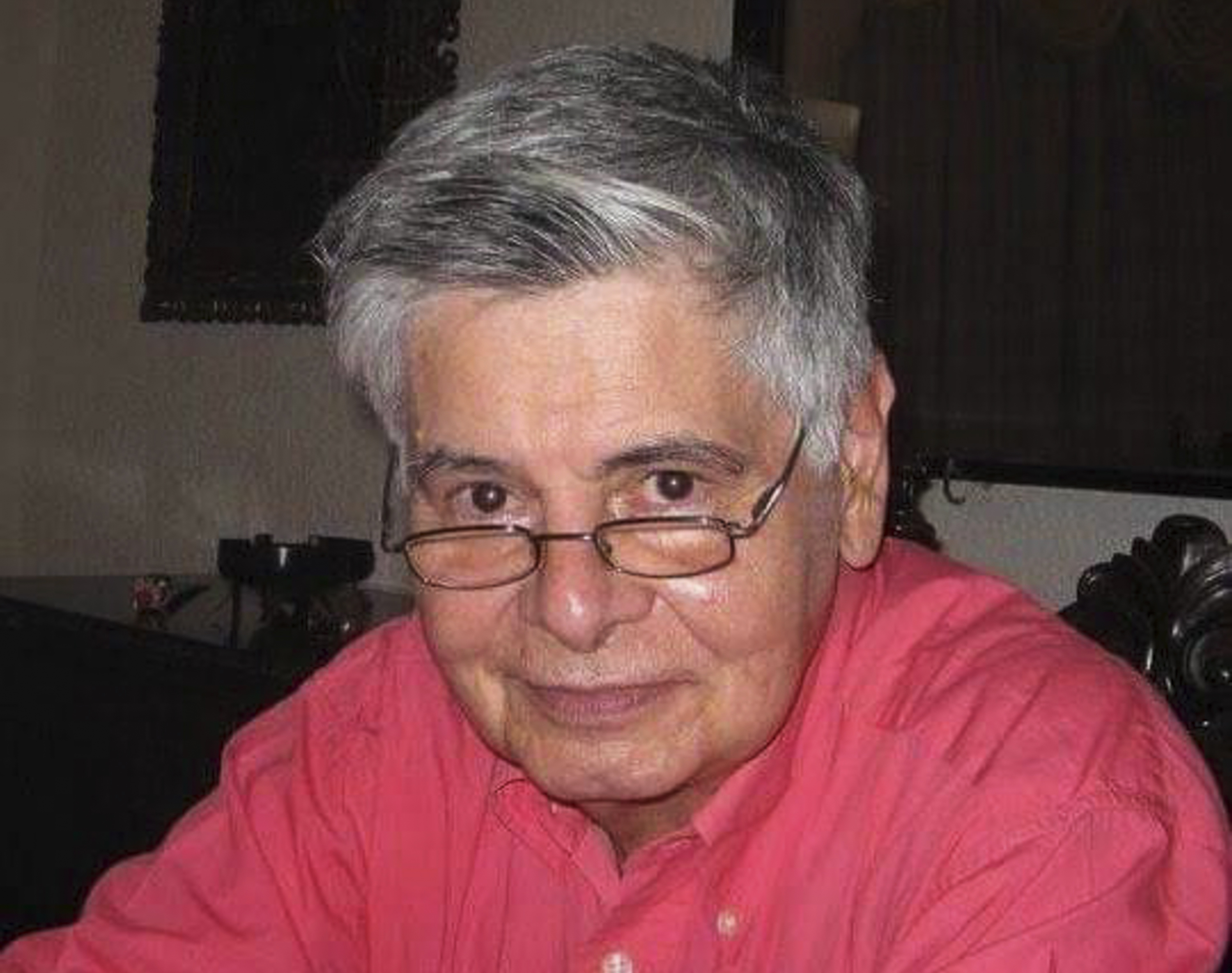 In this photo provided by his son Jose Olmos, award-winning Bolivian journalist Harold Olmos is seen at his home in Santa Cruz, Bolivia, Dec. 31, 2016. Olmos, whose gentlemanly manner belied a remarkable reportorial tenacity and who led Associated Press operations in Venezuela and Brazil after fleeing his coup-convulsed homeland more than four decades earlier, died Wednesday, April 5, 2023. He was 78. (Jose Olmos via AP)