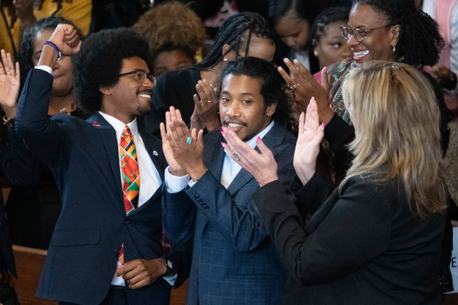 Expelled Rep. Justin Pearson, D-Memphis, from left, expelled Rep. Justin Jones, D-Nashville, and Rep. Gloria Johnson, D-Knoxville, are recognized by the audience at Fisk University before Vice President Kamala Harris arrives, Friday, April 7, 2023, in Nashville, Tenn. (AP Photo/George Walker IV)