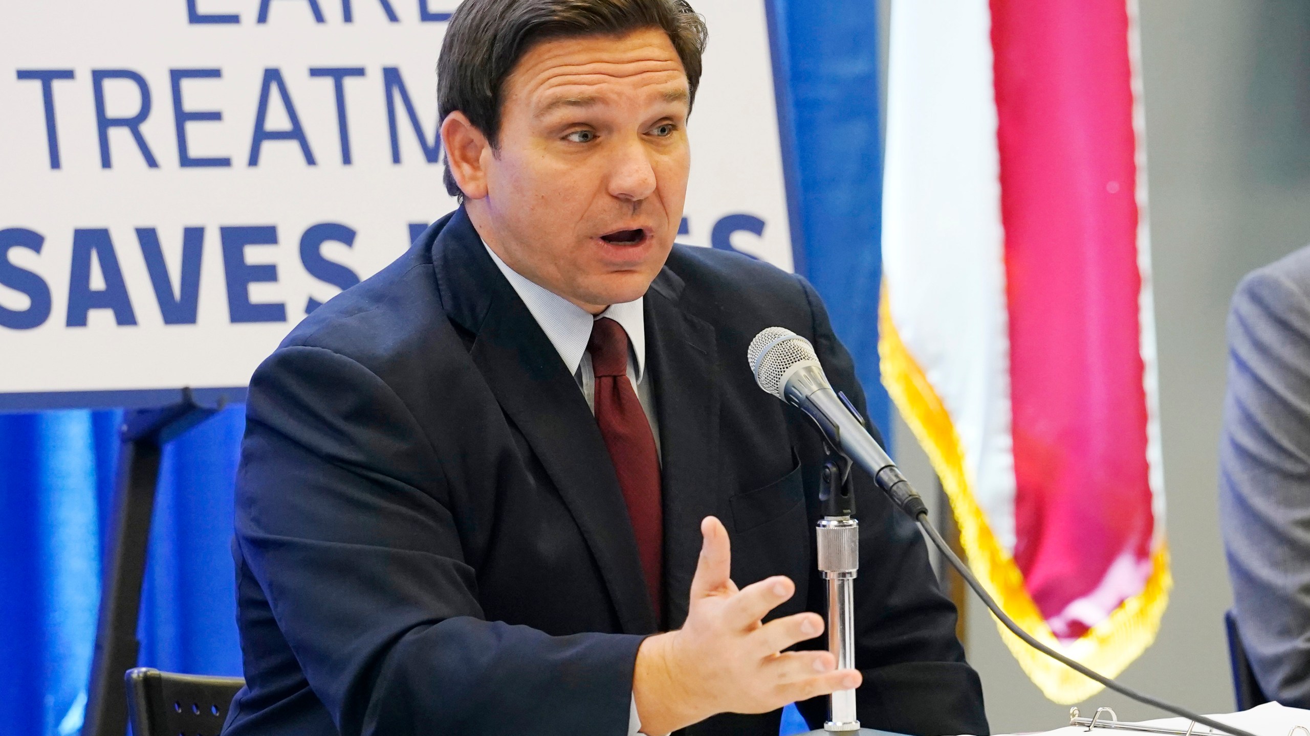 FILE - Florida Gov. Ron DeSantis complains about the FDA's decision to revoke its emergency authorization for two COVID-19 monoclonal antibody treatments during a press conference on Jan. 26, 2022, in North Miami, Fla. (AP Photo/Marta Lavandier, File)