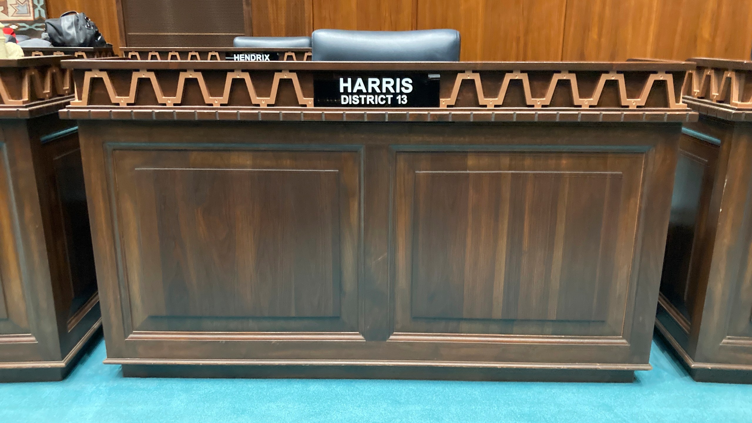 The desk used by Arizona Republican Rep. Liz Harris at the state Capitol in Phoenix stands empty moments after she was expelled from the Legislature on Wednesday, April 12, 2023. The Arizona House of Representatives expelled a Harris in a bipartisan vote after she organized a presentation accusing a wide range of politicians, judges and public officials of both parties of taking bribes from a Mexican drug cartel. (AP Photo/Jonathan J. Cooper)