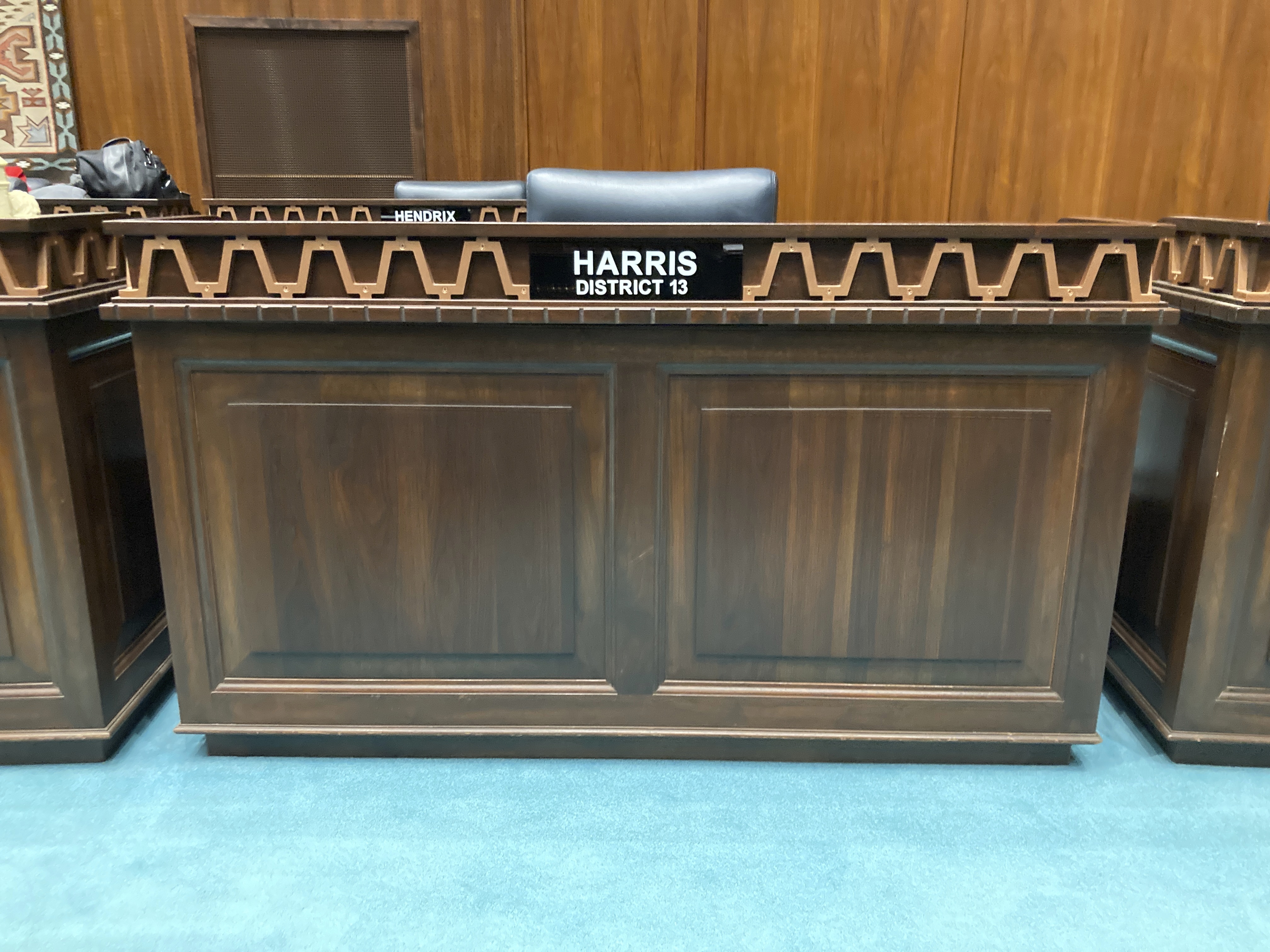 The desk used by Arizona Republican Rep. Liz Harris at the state Capitol in Phoenix stands empty moments after she was expelled from the Legislature on Wednesday, April 12, 2023. The Arizona House of Representatives expelled a Harris in a bipartisan vote after she organized a presentation accusing a wide range of politicians, judges and public officials of both parties of taking bribes from a Mexican drug cartel. (AP Photo/Jonathan J. Cooper)