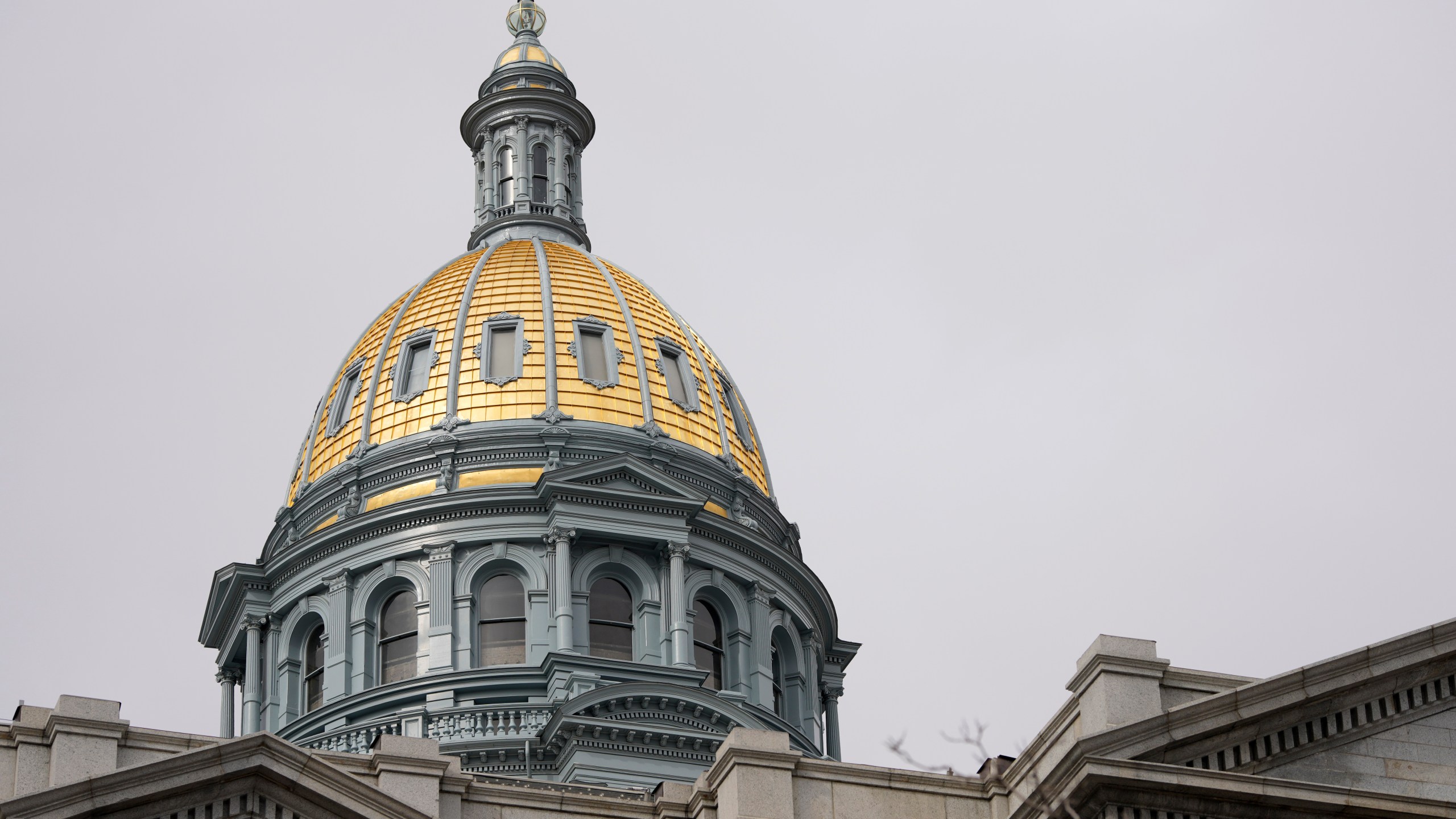 FILE - The gold dome of the Colorado State Capitol on March 23, 2023, in Denver. In Colorado, House lawmakers approved a measure Wednesday, April 12, that would lower the maximum interest rate for medical debt to 3%, require greater transparency in costs of treatment and prohibit debt collection during an appeals process. (AP Photo/David Zalubowski, File)