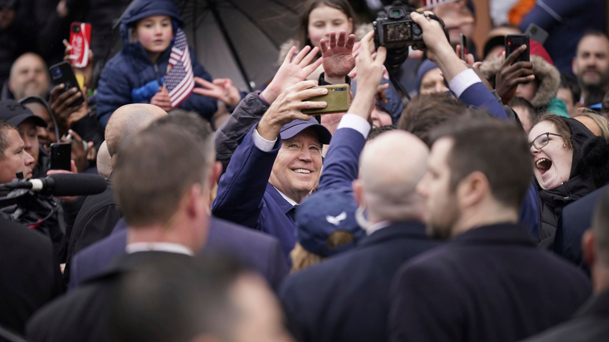 President Joe Biden takes a selfie while on a walkabout through Dundalk, County Louth, during his trip Ireland, Wednesday April 12, 2023. (Niall Carson/PA via AP)