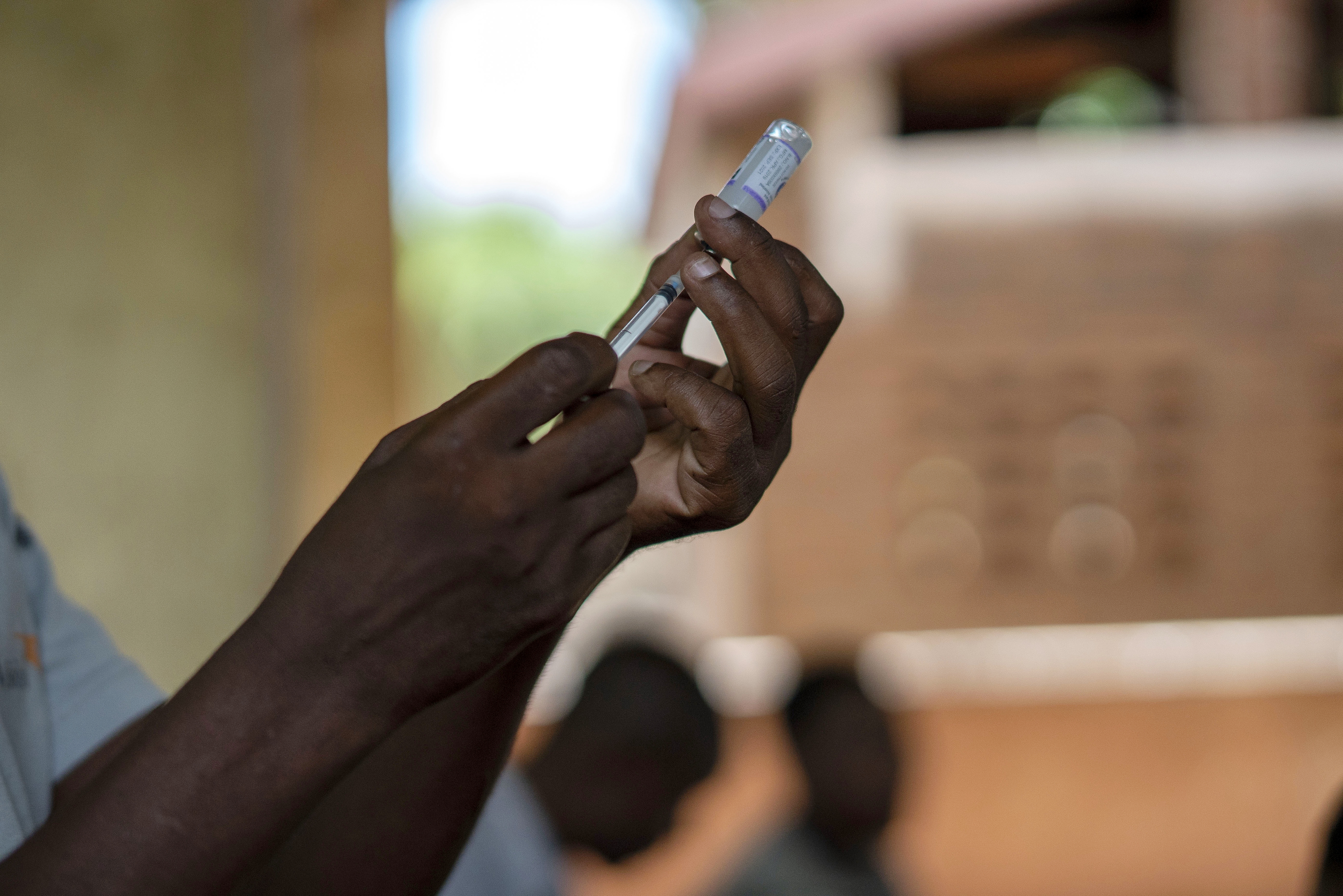 FILE - Health officials prepare to administer a vaccine in the Malawi village of Tomali with the world's first vaccine against malaria in a pilot program in Tomali, Dec. 11, 2019. The University of Oxford said Thursday April 13, 2023 that Ghana is the first country to approve a new Malaria vaccine in a "first crucial step" to helping children combat the disease. The vaccine —known as R21/Matrix-M — is not yet public, but Ghana's Food and Drug Authority has granted full approval for children between five and 36 months(AP Photo/Jerome Delay, File)