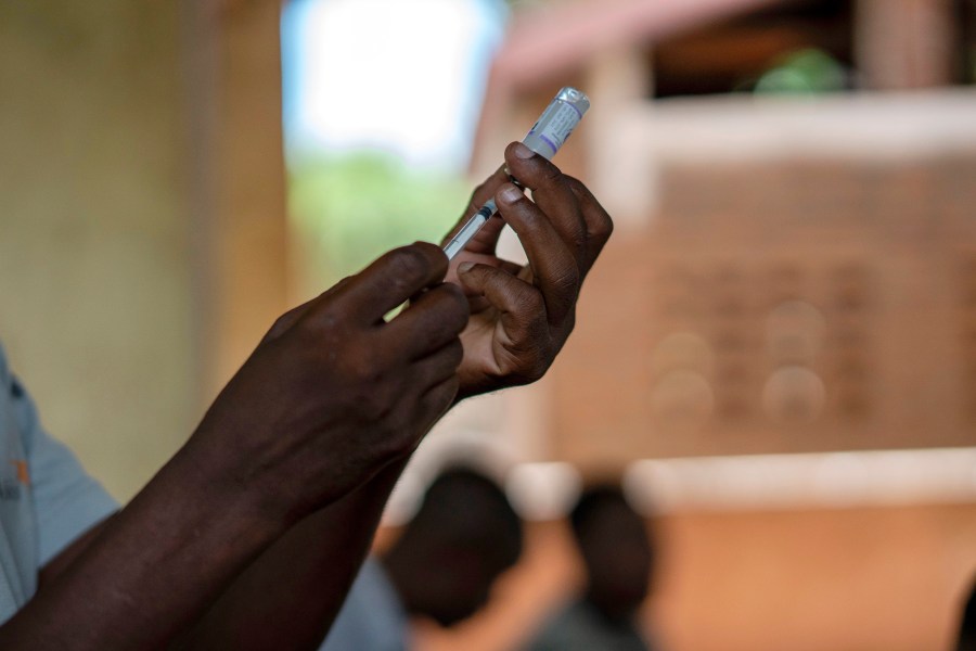 FILE - Health officials prepare to administer a vaccine in the Malawi village of Tomali with the world's first vaccine against malaria in a pilot program in Tomali, Dec. 11, 2019. The University of Oxford said Thursday April 13, 2023 that Ghana is the first country to approve a new Malaria vaccine in a "first crucial step" to helping children combat the disease. The vaccine —known as R21/Matrix-M — is not yet public, but Ghana's Food and Drug Authority has granted full approval for children between five and 36 months(AP Photo/Jerome Delay, File)