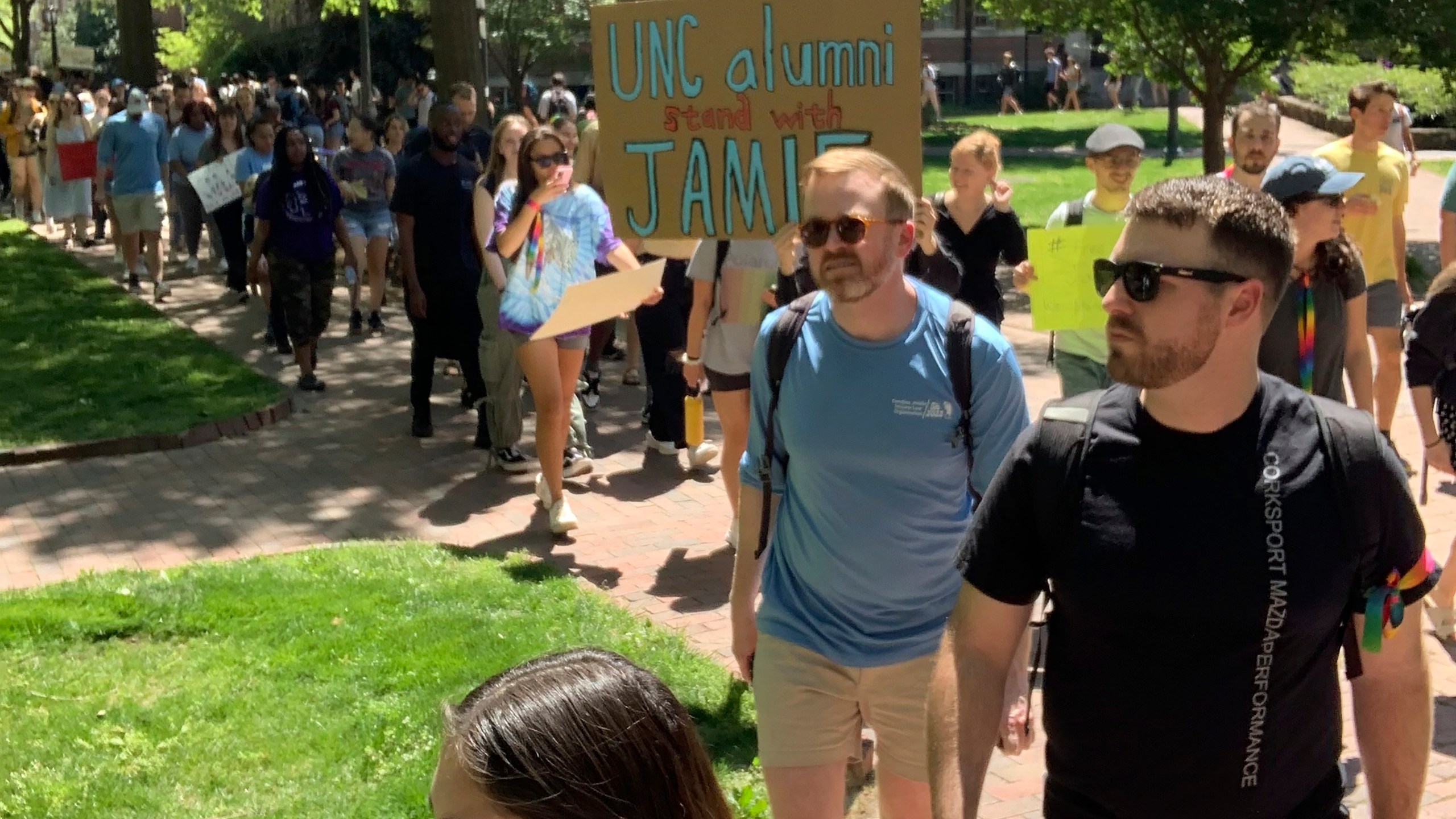 Students march across the campus of the University of North Carolina-Chapel Hill on Thursday, April 13, 2023, to protest school officials' decision to ban a law student from school grounds. Jamie Marsicano was arrested last month on a domestic terrorism charge in Georgia, but classmates say the charge is baseless and that Marsicano is a valued member of the UNC community. (Yasmin Khoedaei via AP)