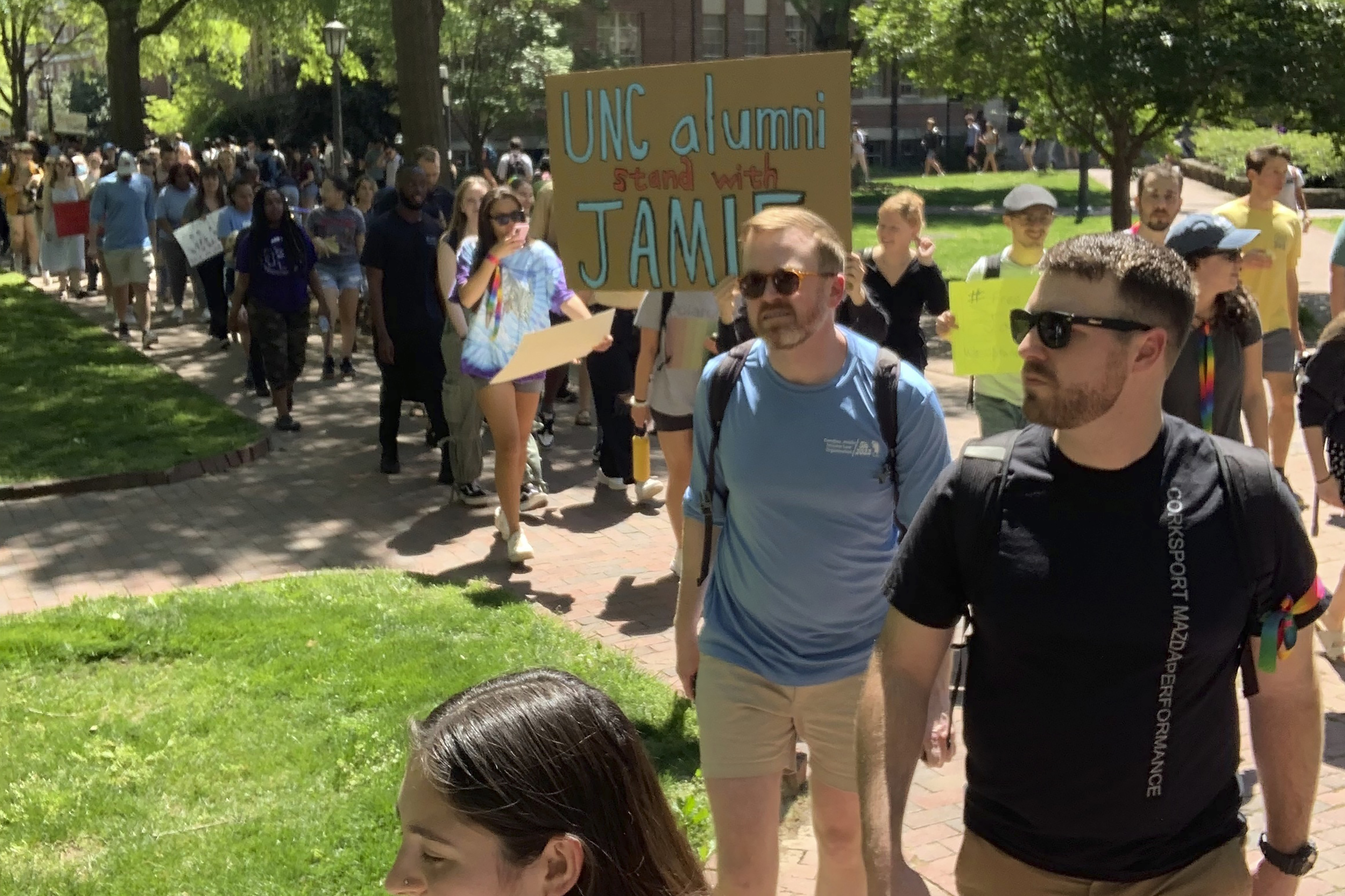 Students march across the campus of the University of North Carolina-Chapel Hill on Thursday, April 13, 2023, to protest school officials' decision to ban a law student from school grounds. Jamie Marsicano was arrested last month on a domestic terrorism charge in Georgia, but classmates say the charge is baseless and that Marsicano is a valued member of the UNC community. (Yasmin Khoedaei via AP)