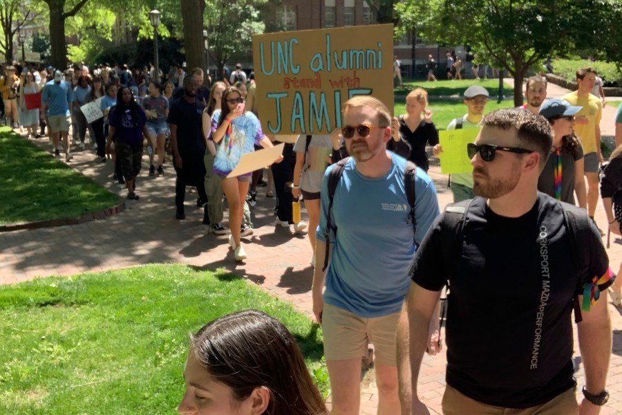 Students march across the campus of the University of North Carolina-Chapel Hill on Thursday, April 13, 2023, to protest school officials' decision to ban a law student from school grounds. Jamie Marsicano was arrested last month on a domestic terrorism charge in Georgia, but classmates say the charge is baseless and that Marsicano is a valued member of the UNC community. (Yasmin Khoedaei via AP)