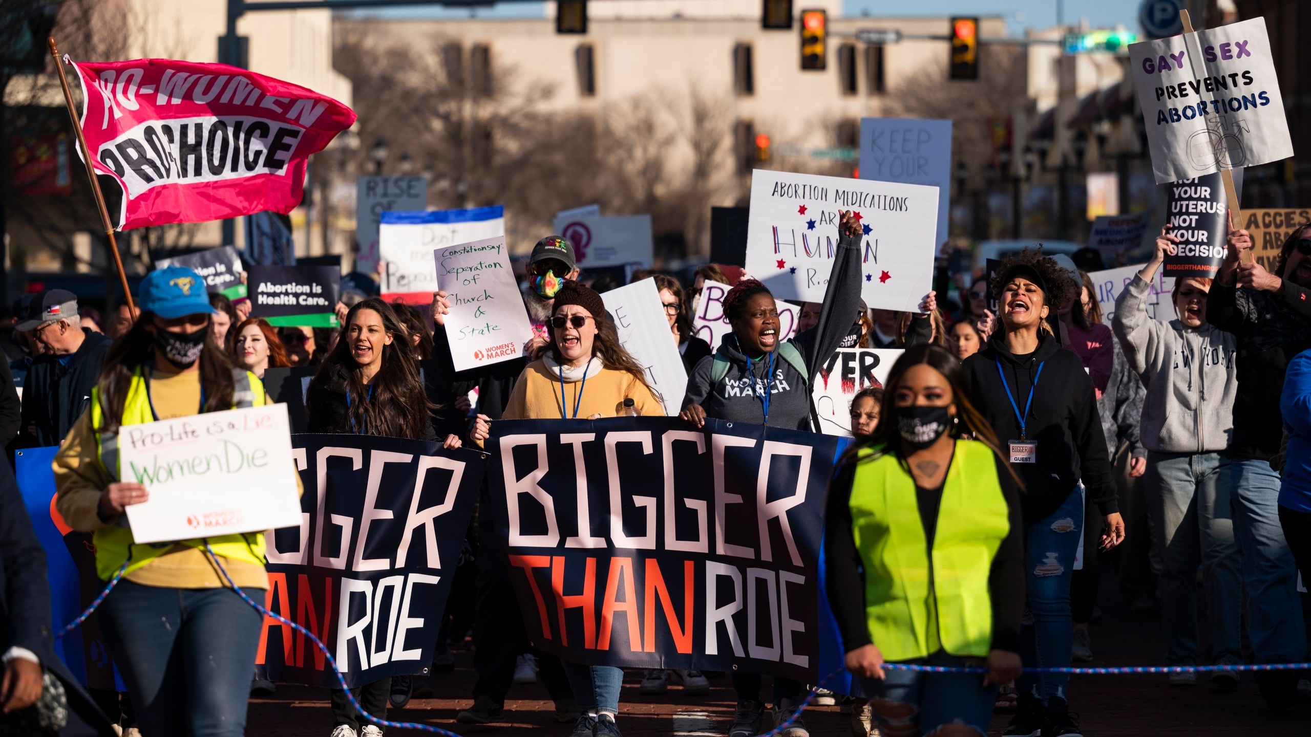 FILE People march through downtown Amarillo to protest a lawsuit to ban the abortion drug mifepristone Saturday, Feb. 11, 2023, in Amarillo, Texas. Some Democrat-controlled states are advancing and adopting laws and executive orders intended to shield their residents against civil lawsuits and criminal investigations related to providing abortions for women from states where there are bans.(AP Photo/Justin Rex, File)