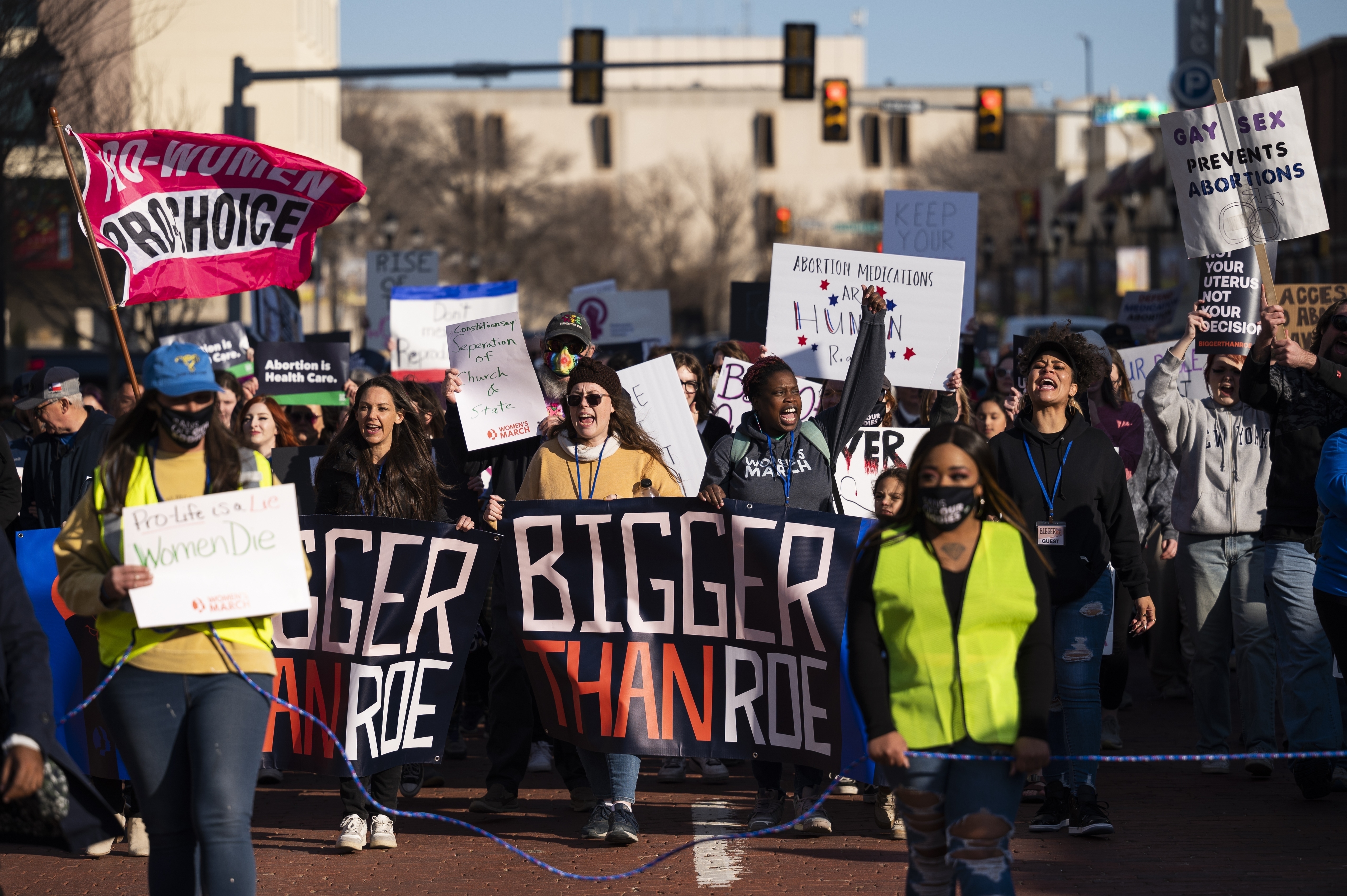 FILE People march through downtown Amarillo to protest a lawsuit to ban the abortion drug mifepristone Saturday, Feb. 11, 2023, in Amarillo, Texas. Some Democrat-controlled states are advancing and adopting laws and executive orders intended to shield their residents against civil lawsuits and criminal investigations related to providing abortions for women from states where there are bans.(AP Photo/Justin Rex, File)