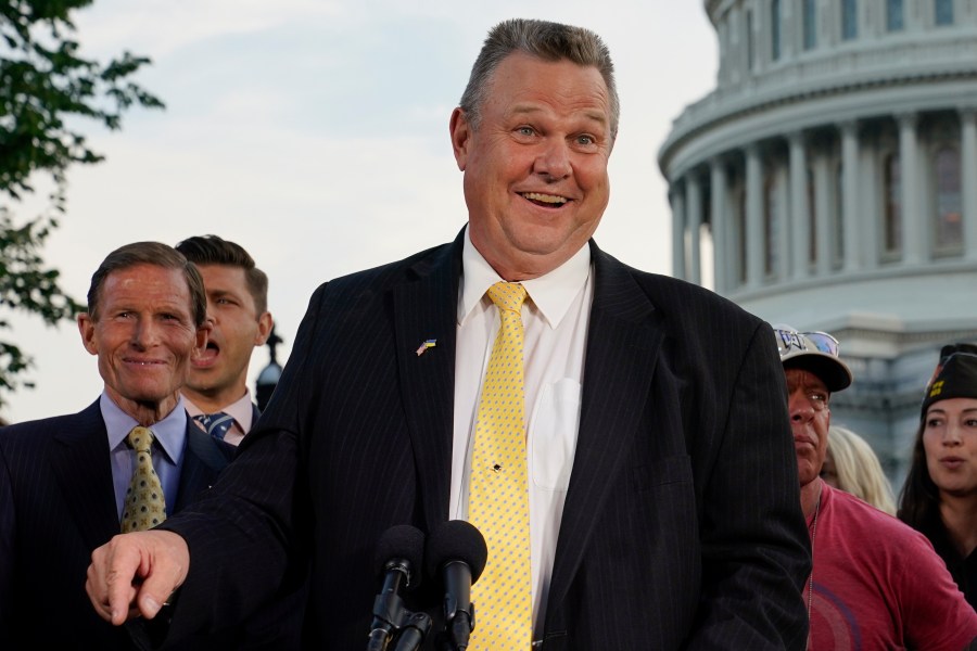 FILE - Sen. Jon Tester, D-Mont., speaks at a news conference alongside Sen. Richard Blumenthal, D-Conn., back left, on Aug. 2, 2022, on Capitol Hill in Washington. Libertarians lined up with Democrats on Friday against a proposal that would effectively block out third party candidates from next year's Montana U.S. Senate election. Republicans are trying to consolidate opposition to incumbent Jon Tester in a race that's pivotal for control of the the Senate. (AP Photo/Patrick Semansky, File)