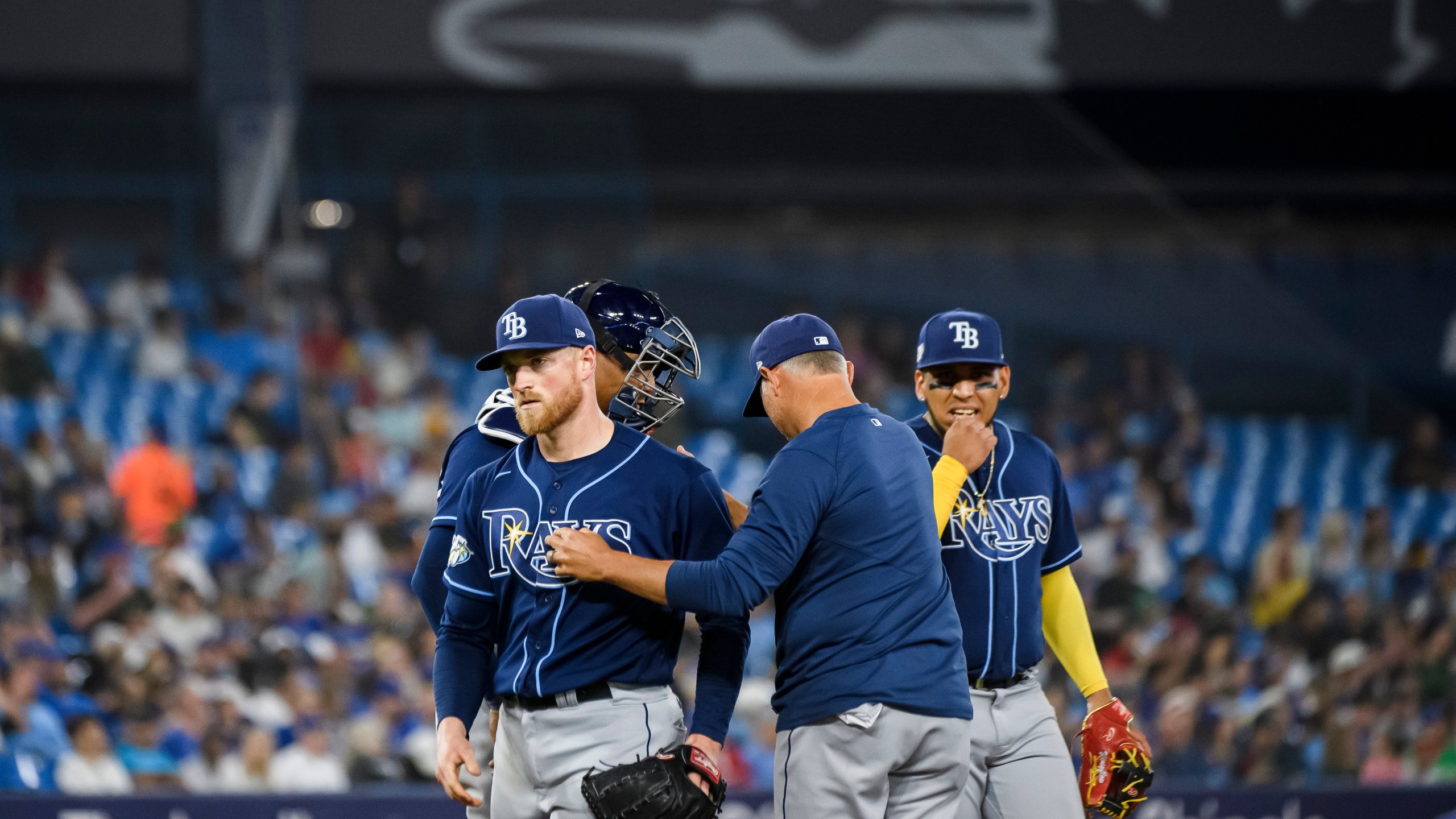 Tampa Bay Rays starting pitcher Drew Rasmussen (57) is removed by manager Kevin Cash during the fifth inning of the team's baseball game against the Toronto Blue Jays on Friday, April 14, 2023, in Toronto. (Christopher Katsarov/The Canadian Press via AP)