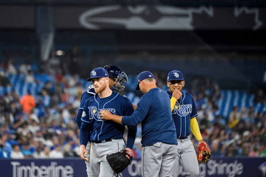 Tampa Bay Rays starting pitcher Drew Rasmussen (57) is removed by manager Kevin Cash during the fifth inning of the team's baseball game against the Toronto Blue Jays on Friday, April 14, 2023, in Toronto. (Christopher Katsarov/The Canadian Press via AP)