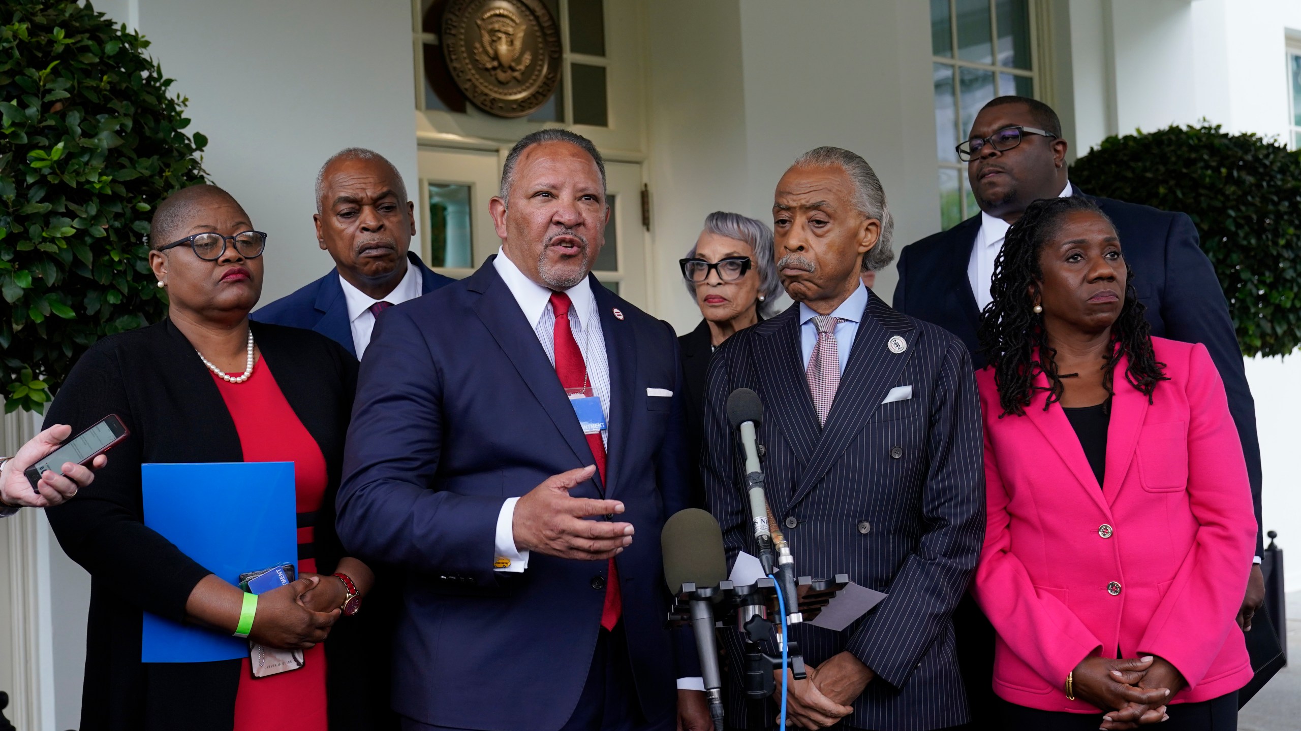 FILE - Marc Morial, center, President and Chief Executive Officer of the National Urban League, talks with reporters outside the West Wing of the White House in Washington, July 8, 2021, following a meeting with President Joe Biden and leadership of top civil rights organizations. Extreme views adopted by some local, state and federal political leaders who try to limit what history can be taught and undermine how Black leaders perform their jobs are among the leading threats to democracy for Black Americans, according to a National Urban League report to be released Saturday, April 15. (AP Photo/Susan Walsh, File)