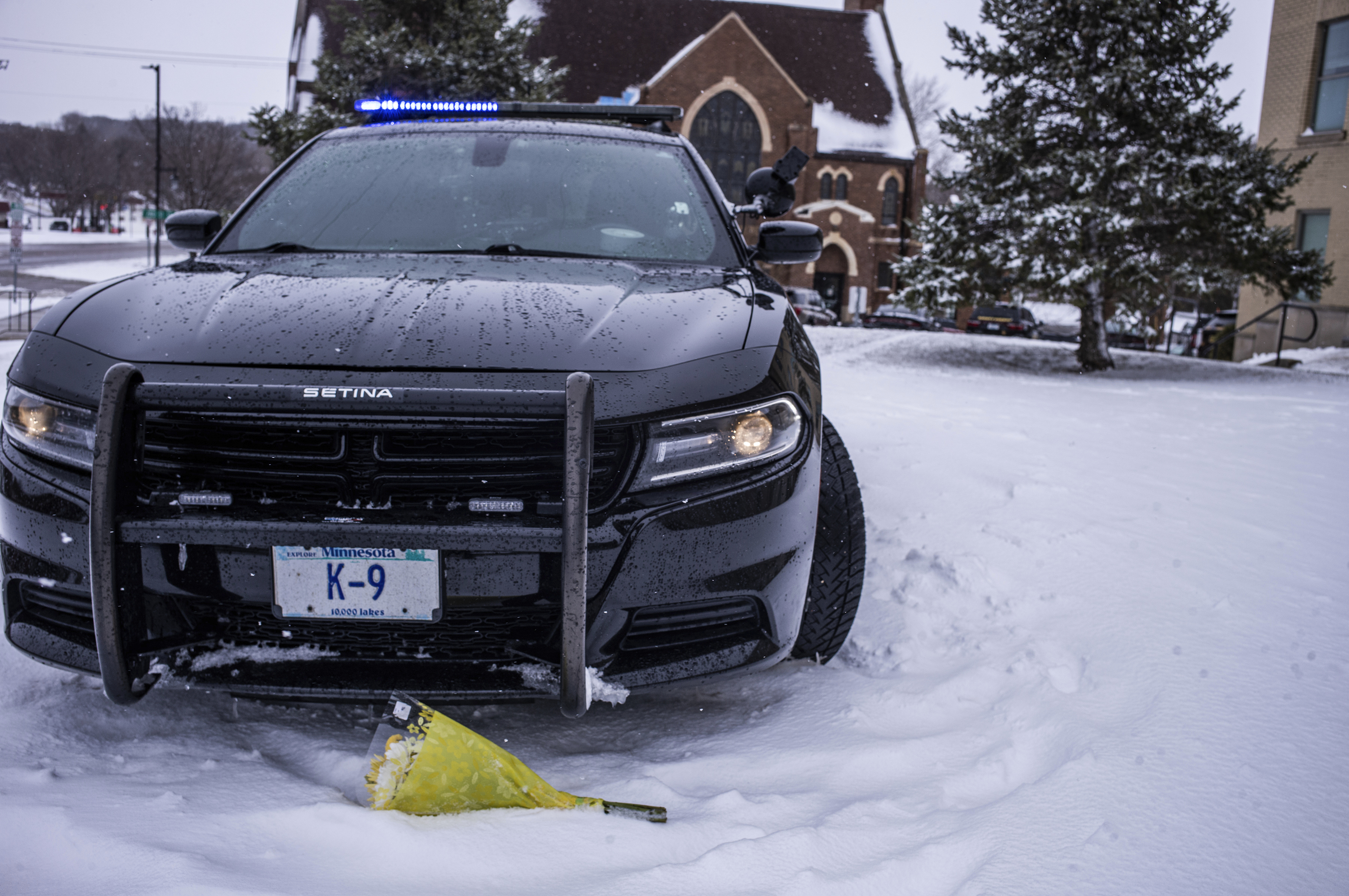 The patrol car of a Joshua Owen, a western Minnesota sheriff's deputy who was shot and killed, sits on display in front of the Pope County Courthouse, in Glenwood, Minn., Sunday, April 16, 2023. One officer from the Starbuck Police Department and two deputies from the Pope County Sheriff's Office were struck by gunfire about 7:30 p.m. Saturday while answering a domestic call at a Cyrus apartment building in the 400 block of N. Stromen Street. (Richard Tsong-Taatarii/Star Tribune via AP)