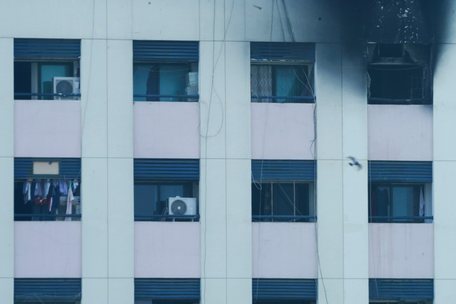 Char marks are seen after an apartment fire in Dubai, United Arab Emirates, Sunday, April 16, 2023. A fire swept through an apartment building in an older neighborhood of Dubai in the United Arab Emirates, killing multiple people and injuring another several, authorities said Sunday. (AP Photo/Jon Gambrell)