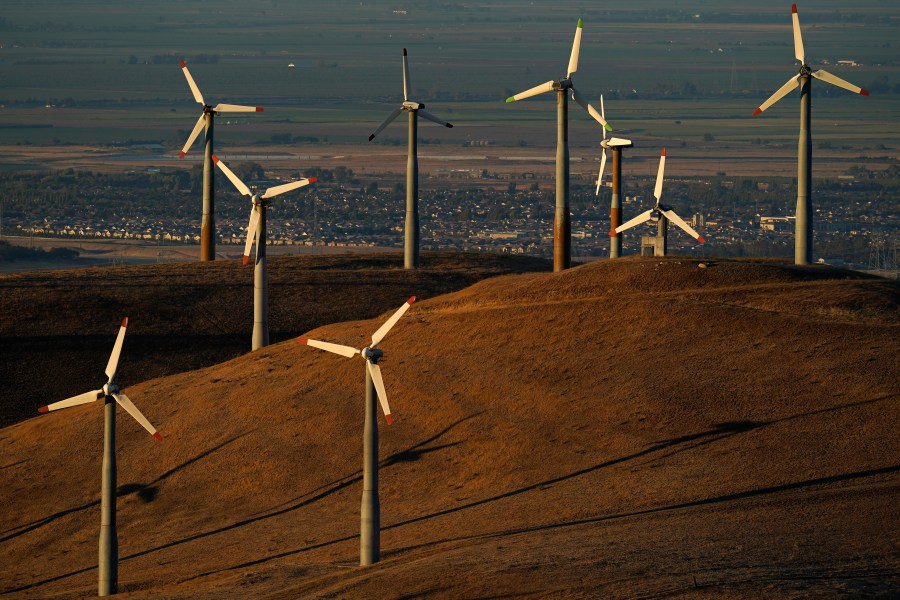 File - Wind turbines operate in Livermore, Calif., on Wednesday, Aug. 10, 2022. Across Europe companies are weighing up the U.S. Inflation Reduction Act's $375 billion in benefits for renewable industries against the European Union's fragmented response. (AP Photo/Godofredo A. Vásquez, File)