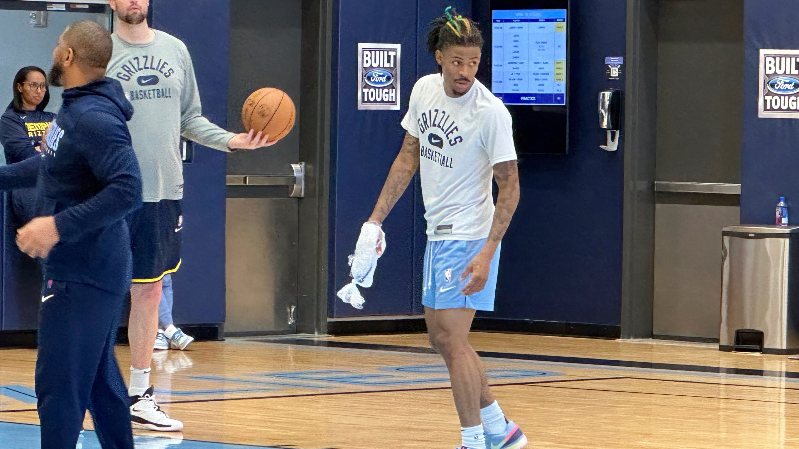 Memphis Grizzlies guard Ja Morant ices his right hand at the end of NBA basketball practice Tuesday, April 18, 2023. Morant had an MRI that showed no ligament damage after he landed awkwardly on his right hand in a loss to the Los Angeles Lakers in Game 1 in the first round of the playoffs Sunday. Coach Taylor Jenkins said Morant is a game-time decision dealing with soft tissue bruising between the bones. (AP Photo/Teresa M. Walker)