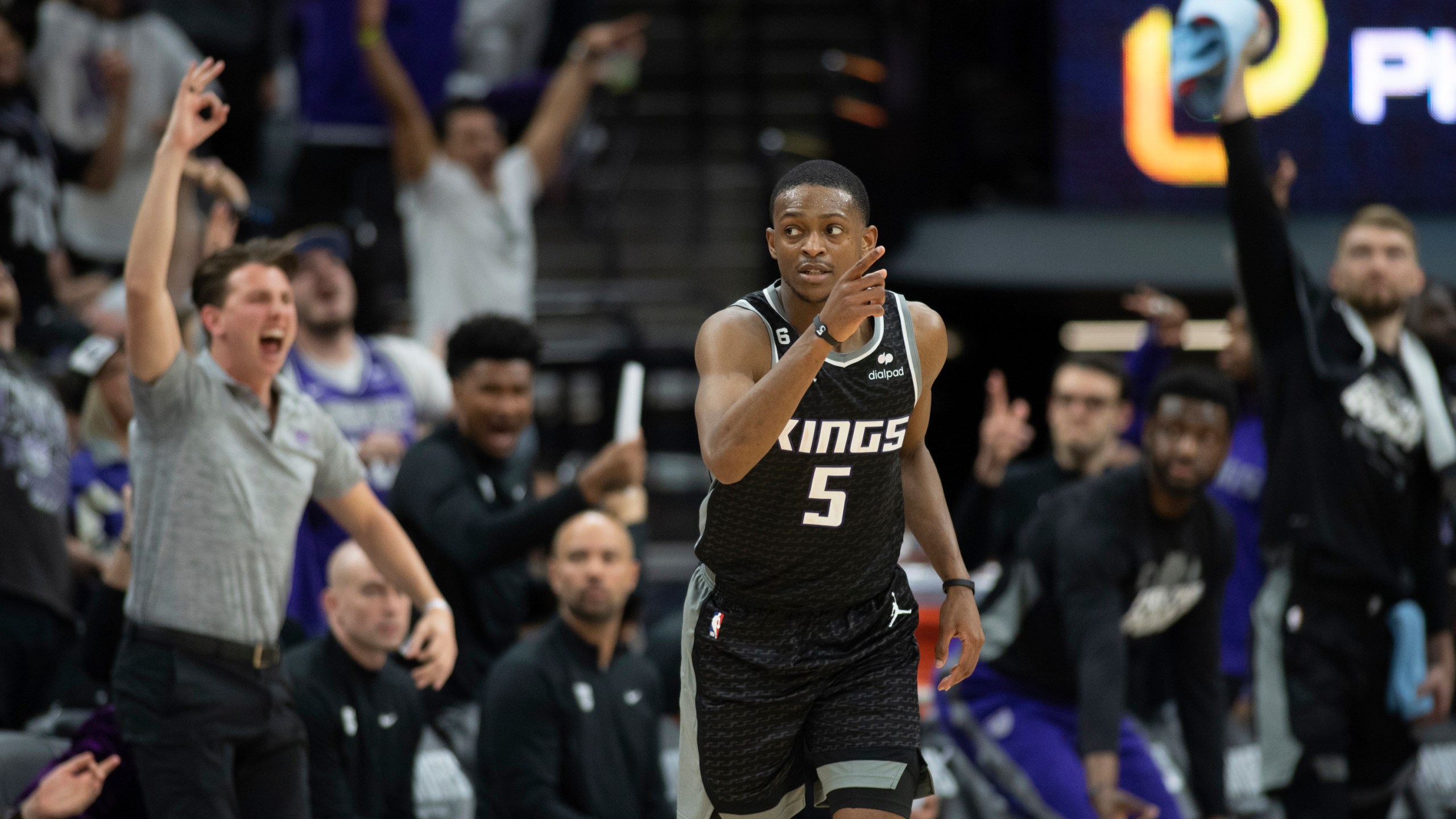 Sacramento Kings guard De'Aaron Fox (5) reacts after making a 3-point basket in the third quarter during Game 1 against the Golden State Warriors in the first round of the NBA basketball playoffs in Sacramento, Calif., Saturday, April 15, 2023. The Kings won 126 - 123. (AP Photo/José Luis Villegas)