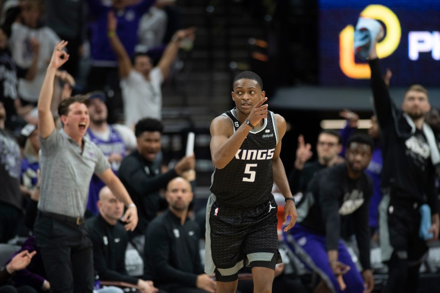 Sacramento Kings guard De'Aaron Fox (5) reacts after making a 3-point basket in the third quarter during Game 1 against the Golden State Warriors in the first round of the NBA basketball playoffs in Sacramento, Calif., Saturday, April 15, 2023. The Kings won 126 - 123. (AP Photo/José Luis Villegas)