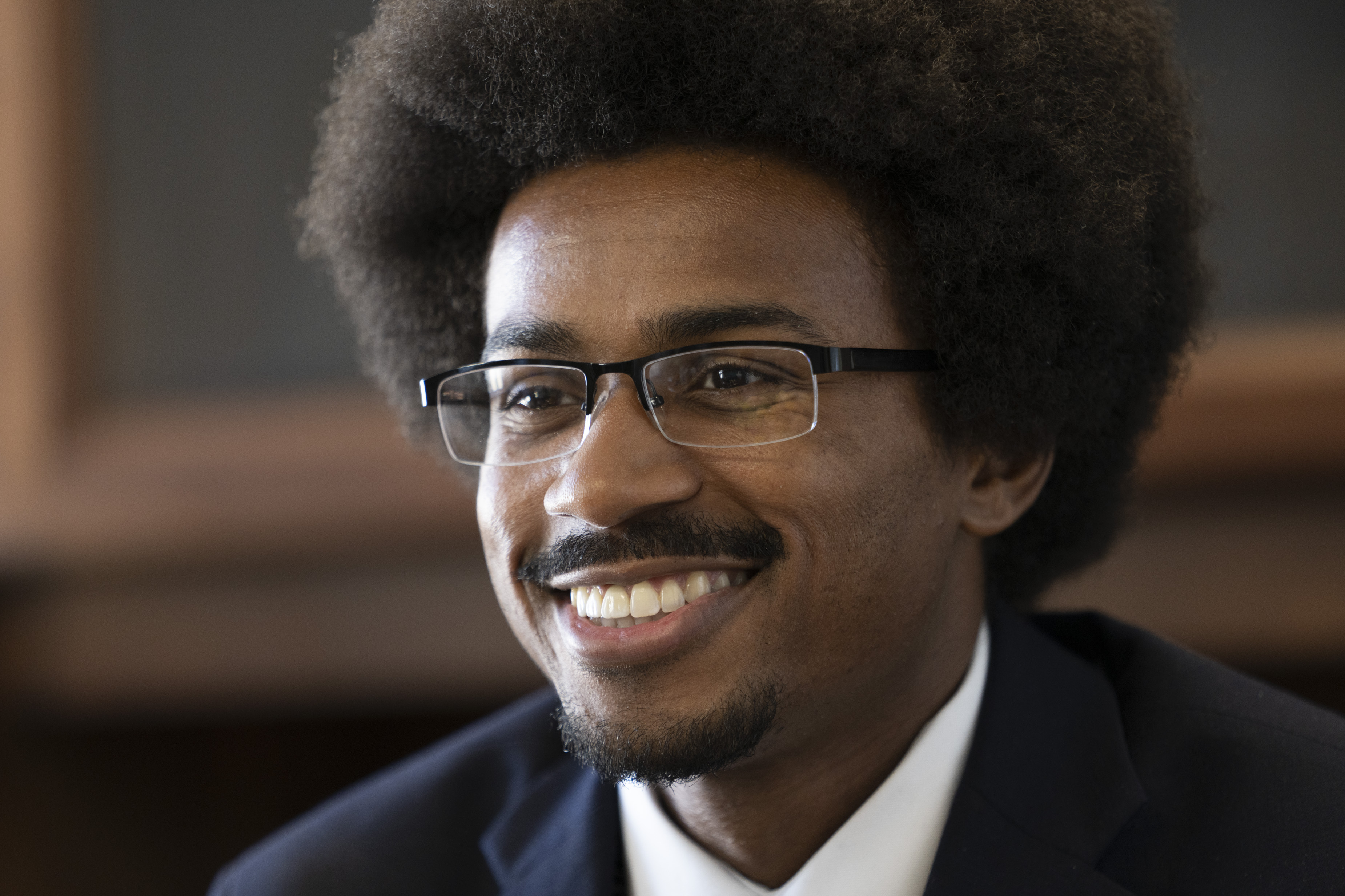 State Rep. Justin Pearson, D-Memphis, smiles as he responds to questions during an interview at his office Monday, April 17, 2023, in Nashville, Tenn. (AP Photo/George Walker IV)