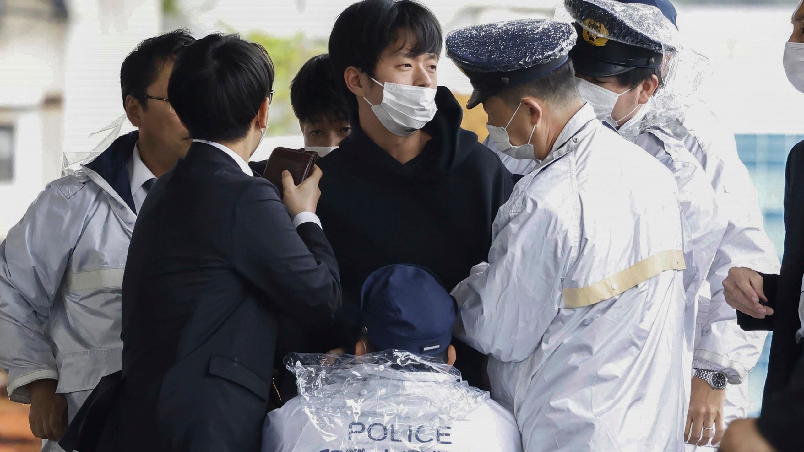 FILE - A man who was later identified as Ryuji Kimura is arrested after what appeared to be a pipe bomb was thrown at Japanese Prime Minister Fumio Kishida during his visit at a port in Wakayama, western Japan, Saturday, April 15, 2023. Kimura, who allegedly threw a pipe bomb at Kishida at a campaign venue, has complained about Japan’s election system and filed a damages suit against the government and criticized the prime minister, according to media reports and his possible social media postings. (Kyodo News via AP, File)