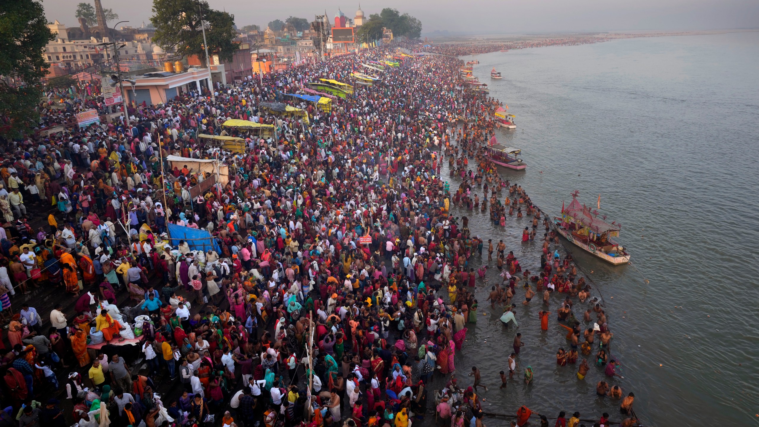 Thousands of Hindu devotees take a holy dip on the occasion of Ramnavi festival, celebrated as the birthday of Hindu God Rama, in Ayodhya, India, Thursday, March 30, 2023. India is on track to become the world's most populous nation, surpassing China by 2.9 million people by mid-2023, according to data released by the United Nations on Wednesday. The South Asian country will have an estimated 1.4286 billion people against China's 1.4257 billion by the middle of the year, according to U.N. projections.(AP Photo/Manish Swarup)