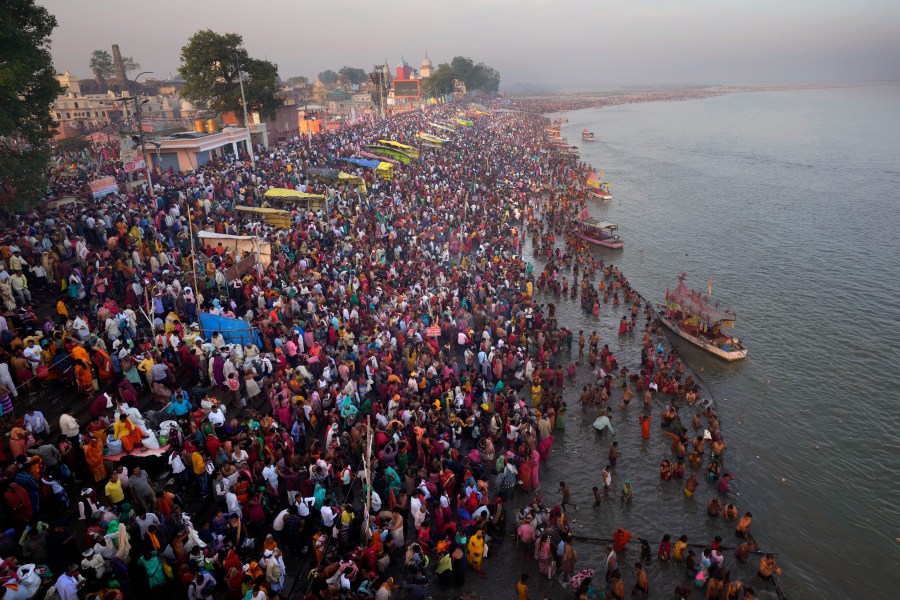 Thousands of Hindu devotees take a holy dip on the occasion of Ramnavi festival, celebrated as the birthday of Hindu God Rama, in Ayodhya, India, Thursday, March 30, 2023. India is on track to become the world's most populous nation, surpassing China by 2.9 million people by mid-2023, according to data released by the United Nations on Wednesday. The South Asian country will have an estimated 1.4286 billion people against China's 1.4257 billion by the middle of the year, according to U.N. projections.(AP Photo/Manish Swarup)