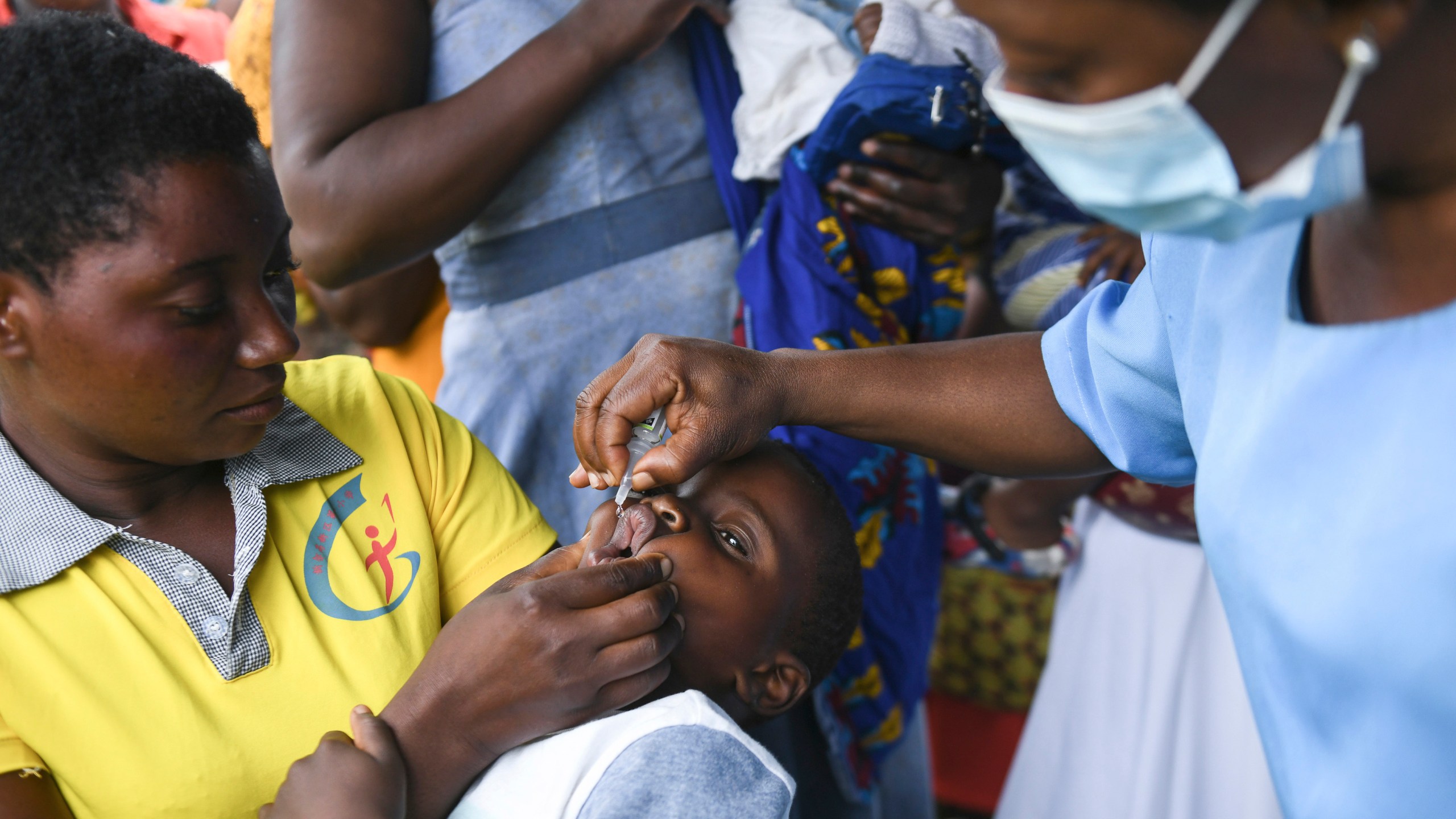 FILE— A child receives a polio vaccine, during the Malawi Polio Vaccination Campaign Launch in Lilongwe Malawi, Sunday March 20, 2022. A new report from UNICEF says nearly 13 million children missed one or more vaccinations in Africa between 2019 and 2021 because of the disruptive impact of the COVID-19 pandemic, (AP Photo/Thoko Chikondi/File)