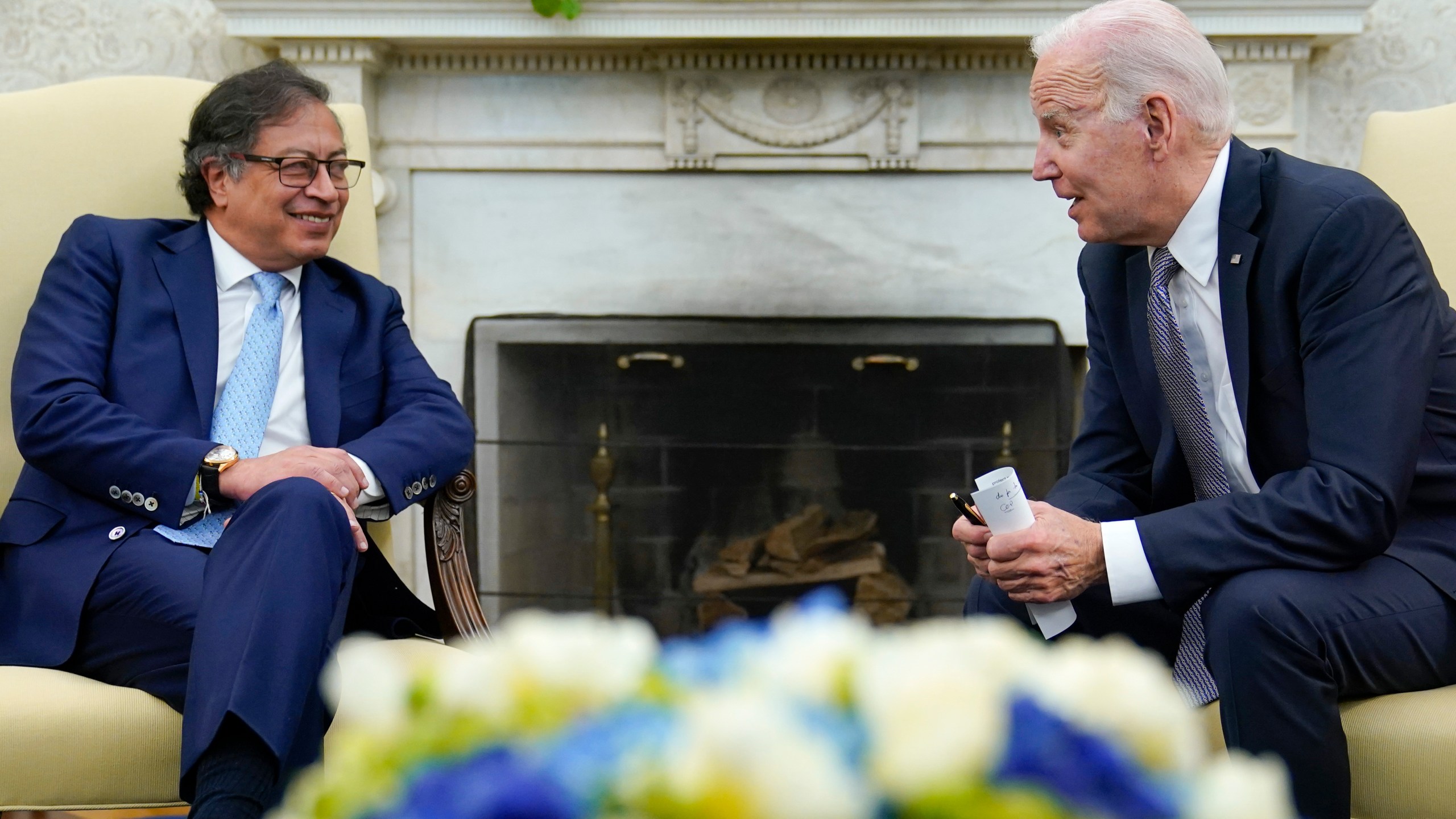 President Joe Biden leans over to speak with Colombian President Gustavo Petro as reporters yell questions after they gave statements in the Oval Office of the White House in Washington, Thursday, April 20, 2023. (AP Photo/Susan Walsh)