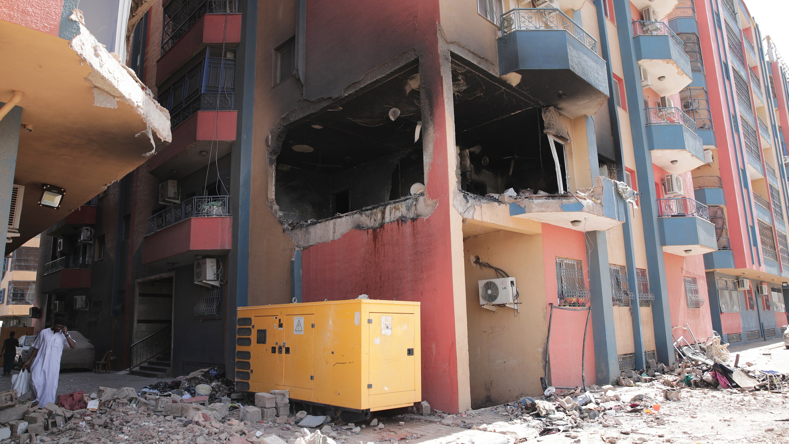 Residential buildings damaged in fighting are seen in Khartoum, Sudan, Thursday, April 20, 2023. The latest attempt at a cease-fire between the rival Sudanese forces faltered as gunfire rattled the capital of Khartoum. Through the night and into Thursday morning, gunfire could be heard almost constantly across Khartoum. (AP Photo/Marwan Ali)