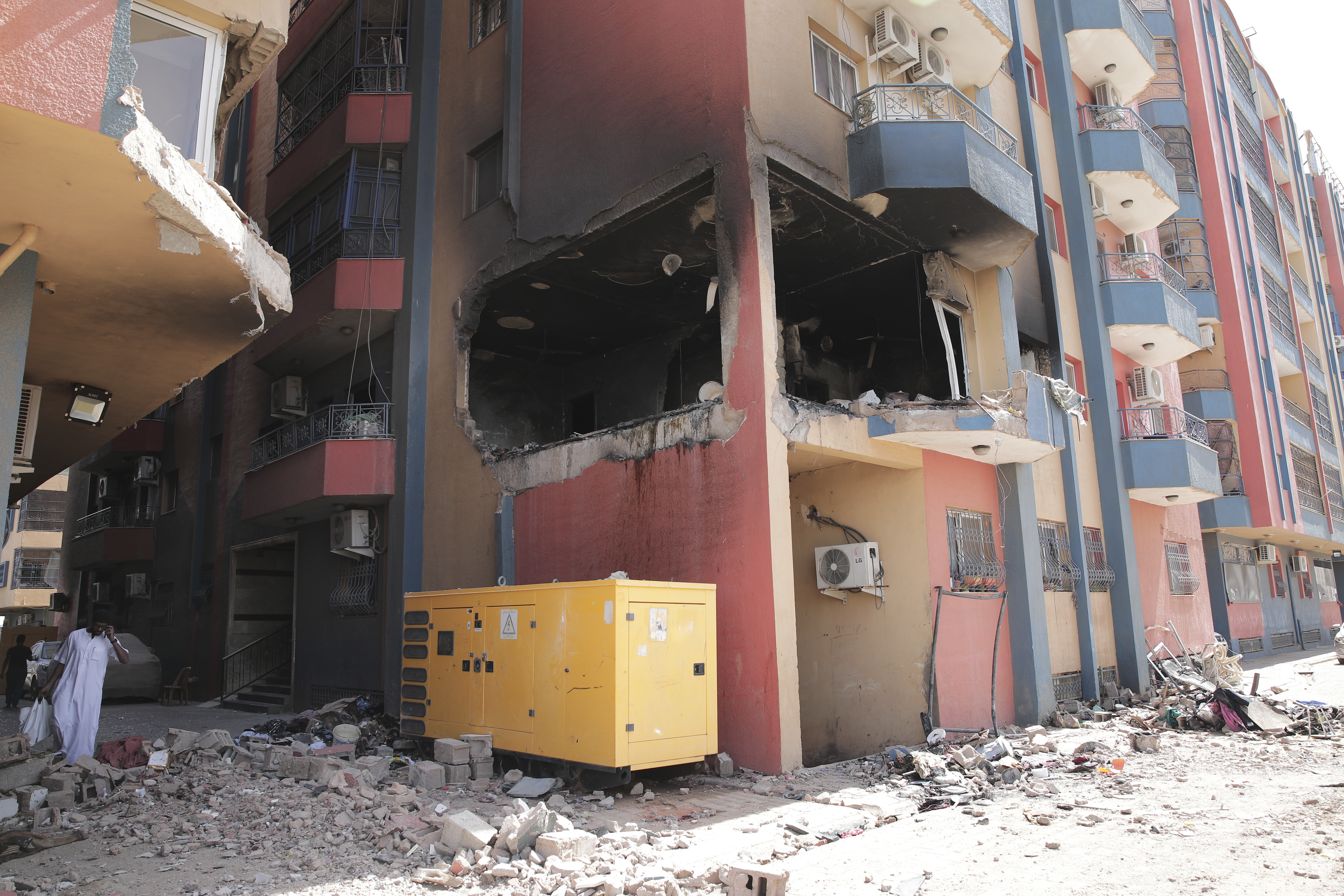 Residential buildings damaged in fighting are seen in Khartoum, Sudan, Thursday, April 20, 2023. The latest attempt at a cease-fire between the rival Sudanese forces faltered as gunfire rattled the capital of Khartoum. Through the night and into Thursday morning, gunfire could be heard almost constantly across Khartoum. (AP Photo/Marwan Ali)