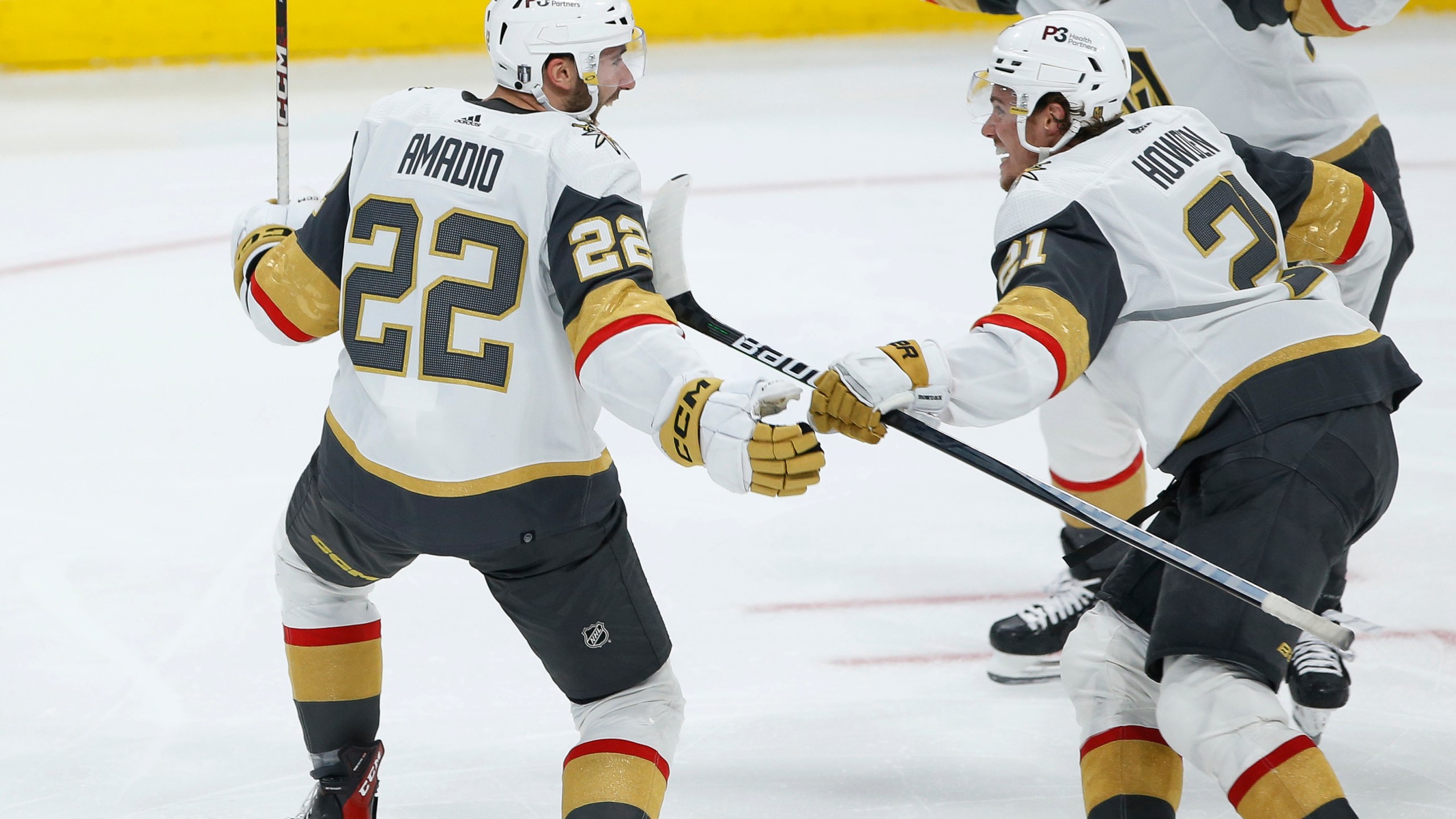 Vegas Golden Knights' Michael Amadio (22), Brett Howden (21) and Ivan Barbashev (49) celebrate Amadio's goal against the Winnipeg Jets in the second overtime in Game 3 of an NHL hockey Stanley Cup first-round playoff series in Winnipeg, Manitoba, Saturday, April 22, 2023. (John Woods/The Canadian Press via AP)