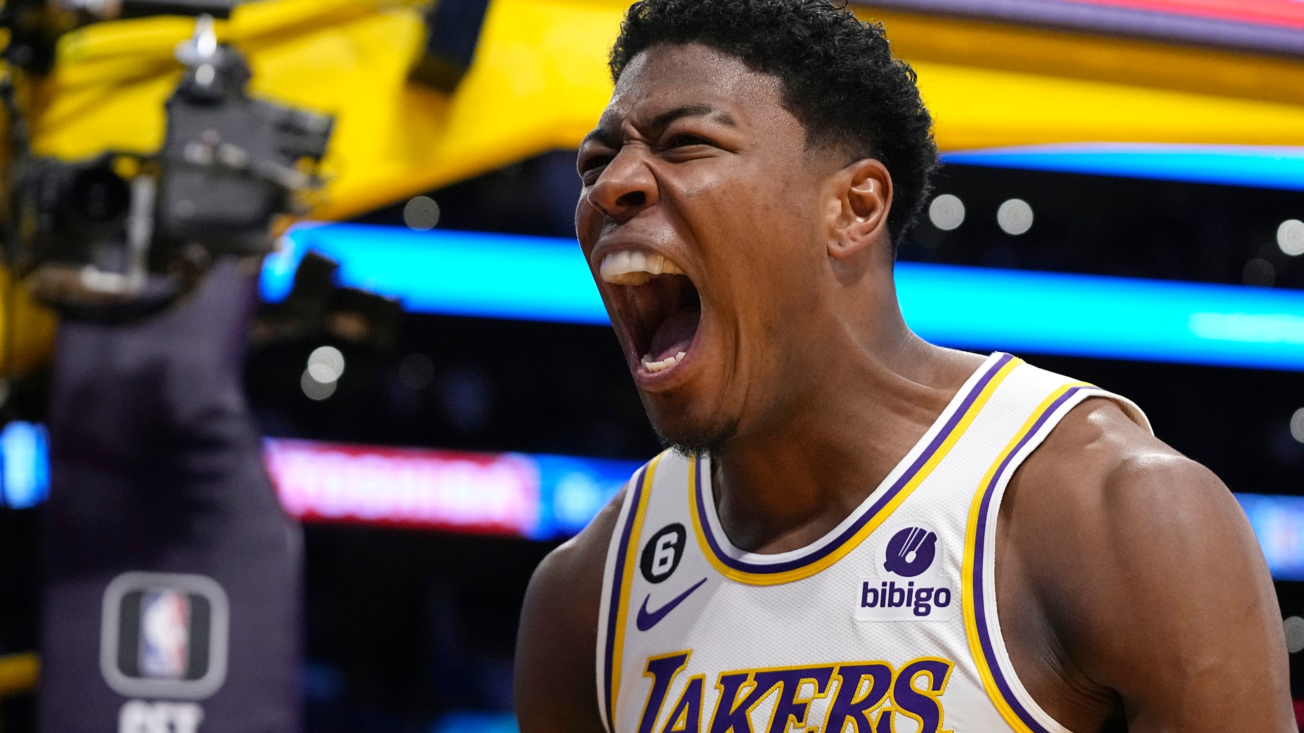 Los Angeles Lakers forward Rui Hachimura, left, celebrates after dunking during the first half in Game 3 of a first-round NBA basketball playoff series against the Memphis Grizzlies Saturday, April 22, 2023, in Los Angeles. (AP Photo/Mark J. Terrill)