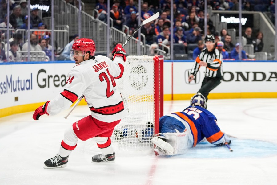 Carolina Hurricanes' Seth Jarvis reacts after scoring a goal during the third period of Game 4 of an NHL hockey Stanley Cup first-round playoff series against the New York Islanders, Sunday, April 23, 2023, in Elmont, N.Y. The Hurricanes won 5-2. (AP Photo/Frank Franklin II)