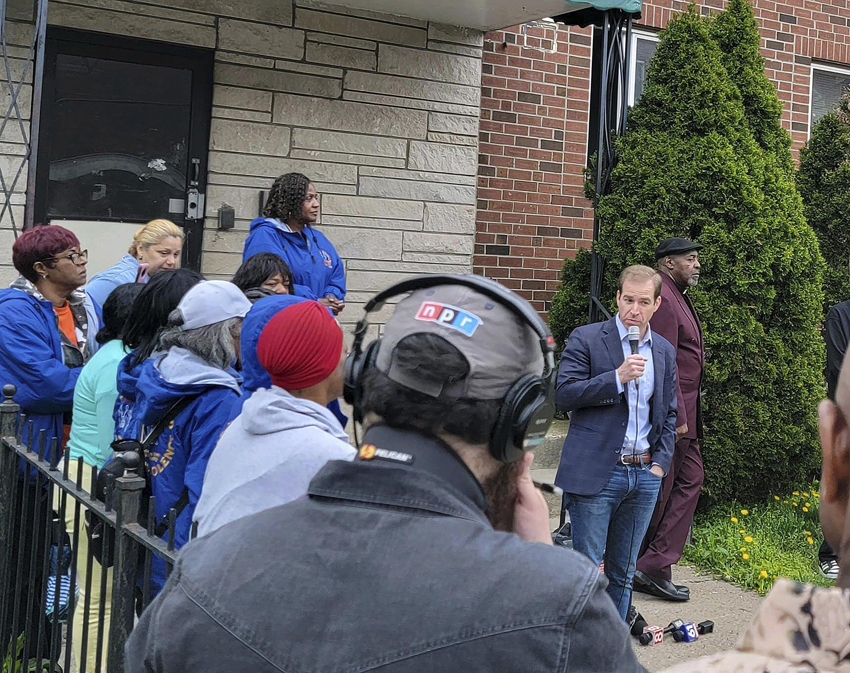 This image provided by Jeremy Stein shows Hartford Mayor Luke Bronin addressing a crowd gathering for a vigil on Saturday, April 22, 2023, on the same street where Se'Cret Pierce, 12, was shot in the head by a stray bullet during a drive-by shooting Thursday. She died the following morning. (Jeremy Stein via AP)