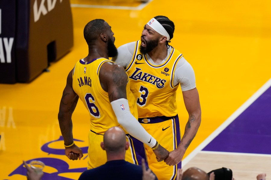 Los Angeles Lakers' LeBron James (6) and Anthony Davis (3) celebrate a basket by James in overtime in Game 4 of a first-round NBA basketball playoff series against the Memphis Grizzlies Monday, April 24, 2023, in Los Angeles. The Lakers won 117-111. (AP Photo/Jae C. Hong)