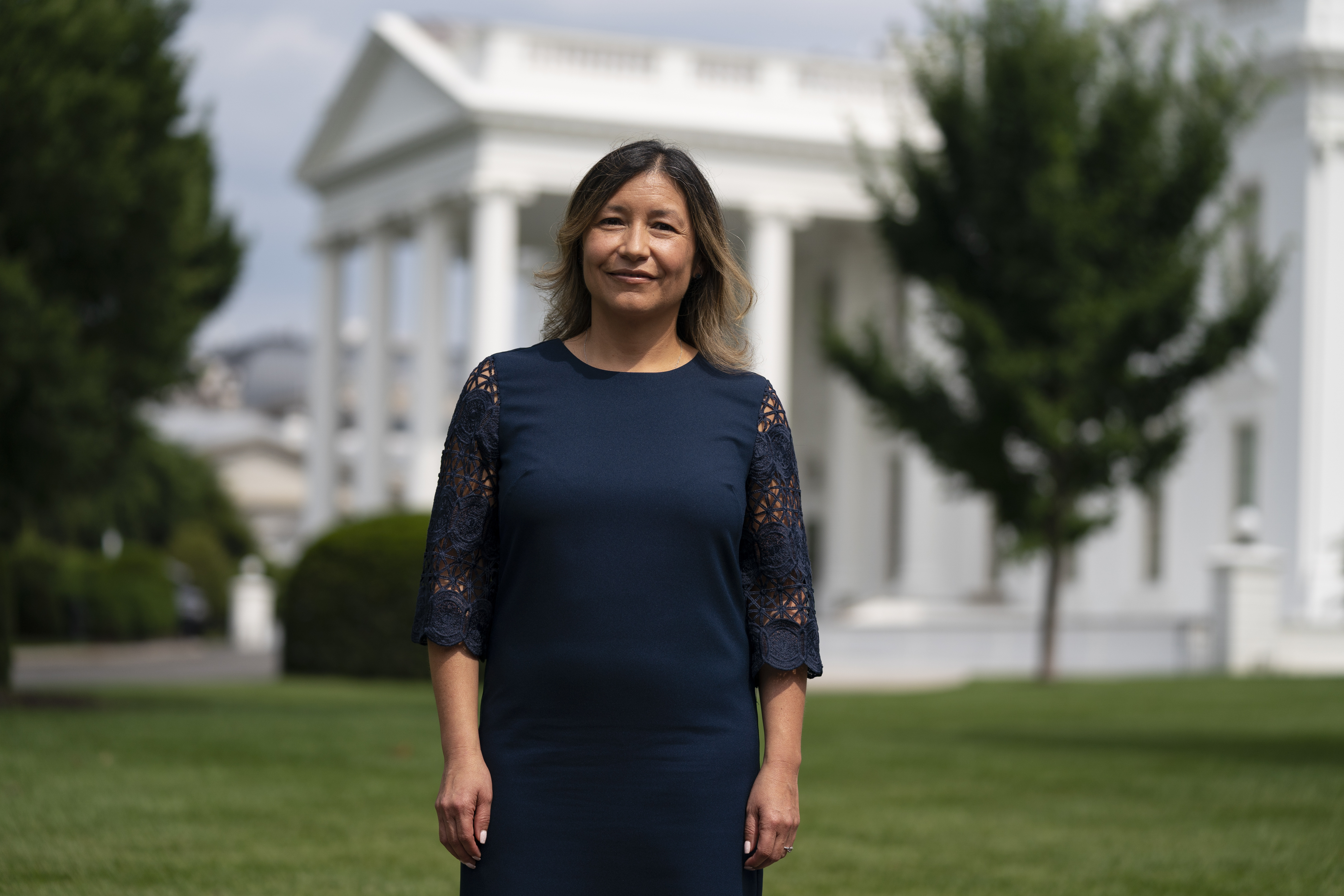 FILE - White House Intergovernmental Affairs director Julie Chavez Rodriguez stands outside the White House, Wednesday, June 9, 2021, in Washington. The granddaughter of Cesar Chavez and a bronze bust of the late Latino labor activist have had prominent places in President Joe Biden’s White House. And now Julie Chavez Rodriguez is moving on from his White House staff to take another high-profile position at the helm of Biden's reelection campaign. (AP Photo/Evan Vucci, File)