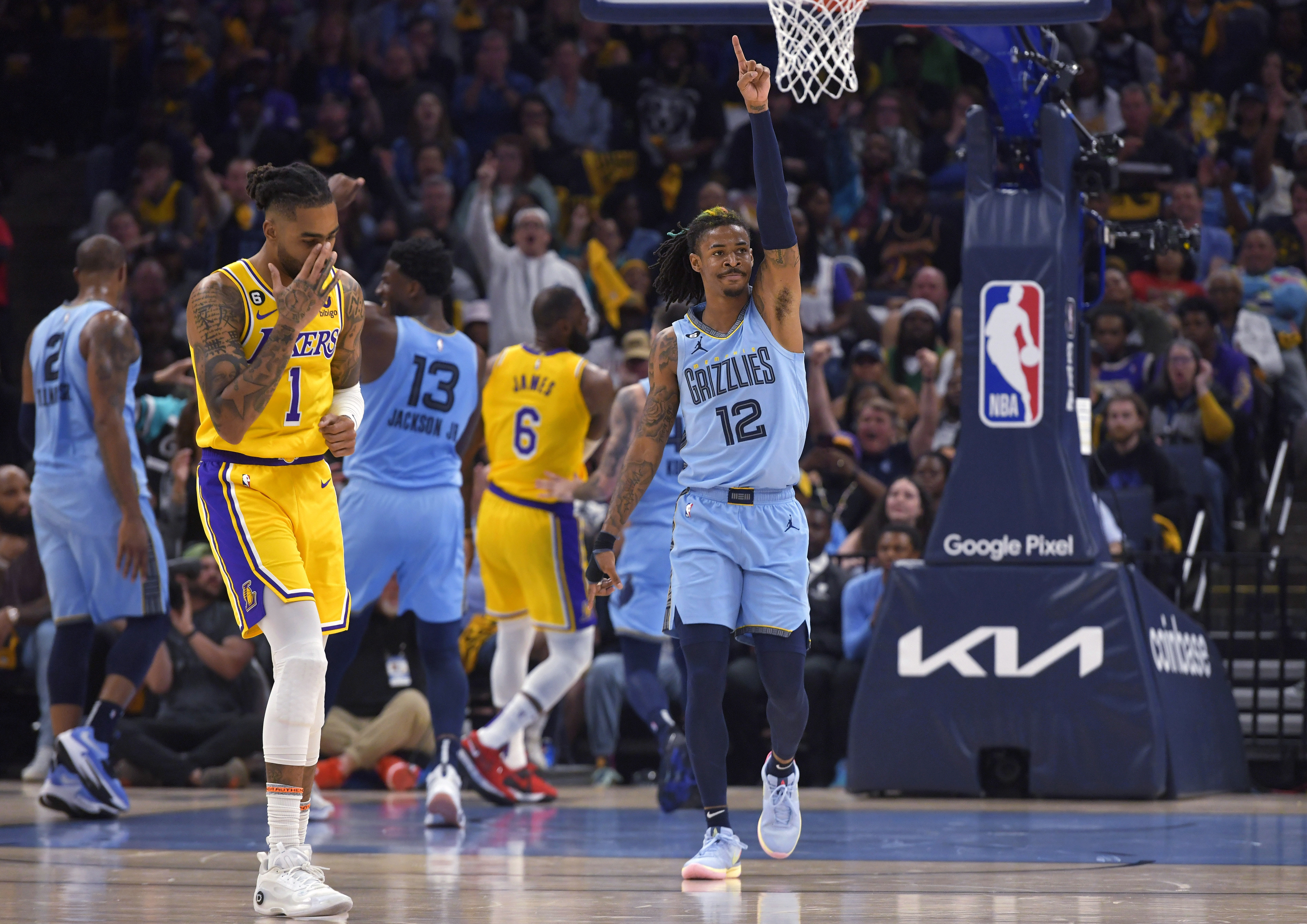 Memphis Grizzlies guard Ja Morant (12) reacts during the first half of Game 5 of the team's first-round NBA basketball playoff series against the Los Angeles Lakers on Wednesday, April 26, 2023, in Memphis, Tenn. (AP Photo/Brandon Dill)