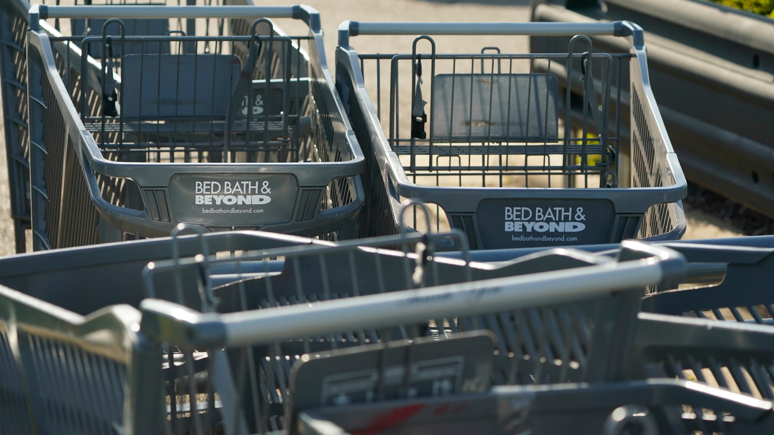 Bed Bath & Beyond shopping carts are left in a corral in Flowood, Miss., on Monday, April 24, 2023. One of the original big box retailers, the company filed for bankruptcy protection on Sunday, April 23, following years of dismal sales and losses. (AP Photo/Rogelio V. Solis)