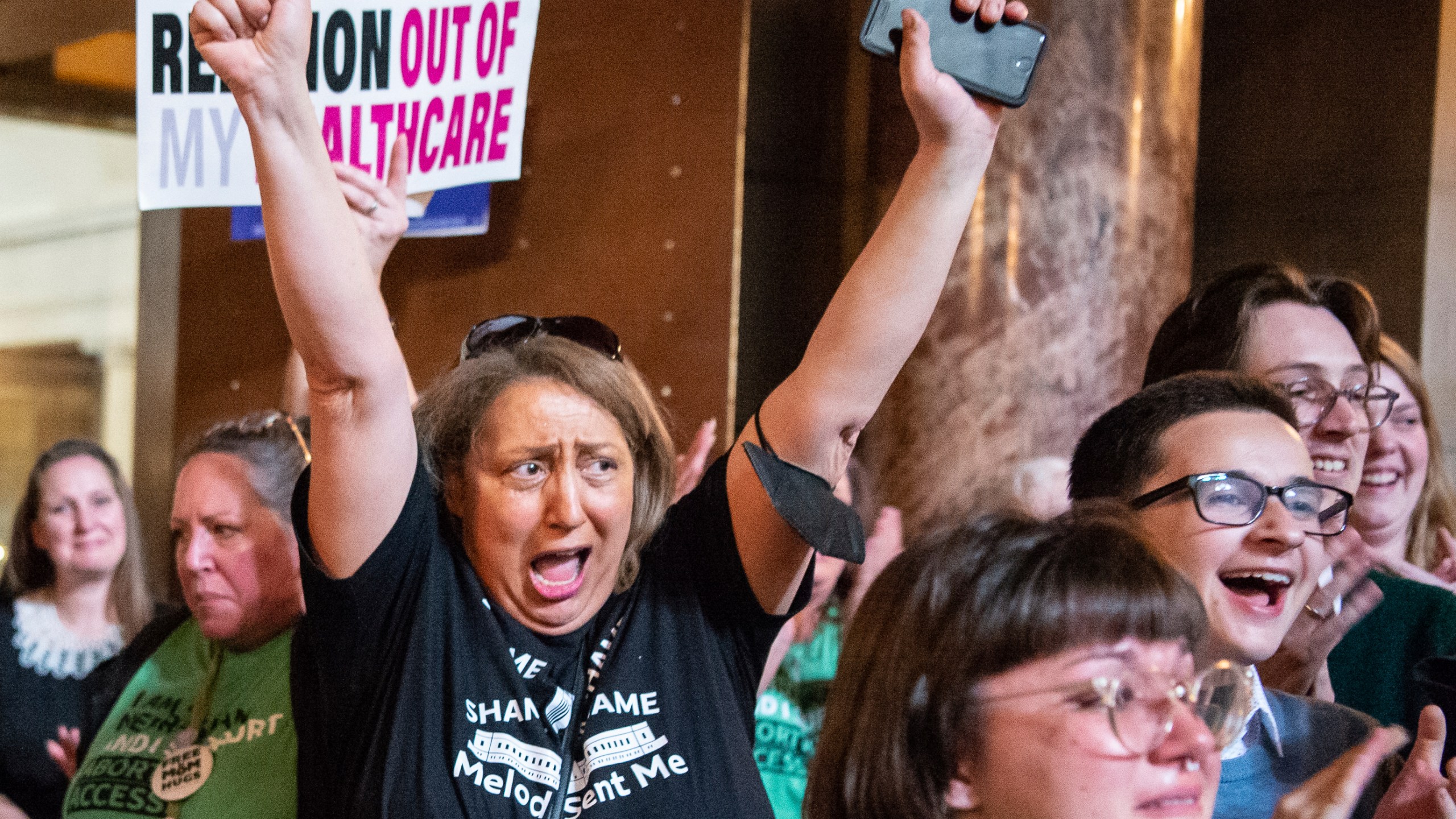 Opponents of LB626, which would have banned abortions in Nebraska after about six weeks, celebrate in the Rotunda after the bill fails to get the votes necessary to invoke cloture, Thursday, April 27, 2023, at the Nebraska State Capital in Lincoln, Neb. (Larry Robinson/Lincoln Journal Star via AP)