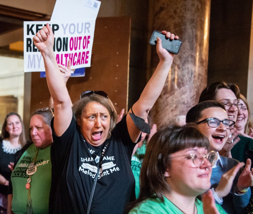 Opponents of LB626, which would have banned abortions in Nebraska after about six weeks, celebrate in the Rotunda after the bill fails to get the votes necessary to invoke cloture, Thursday, April 27, 2023, at the Nebraska State Capital in Lincoln, Neb. (Larry Robinson/Lincoln Journal Star via AP)