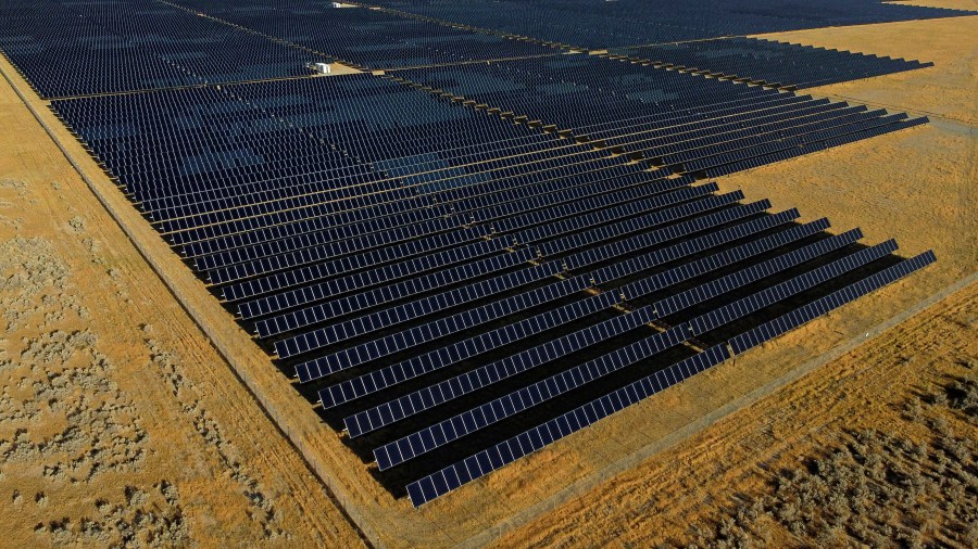 FILE - A solar farm sits in Mona, Utah, on Tuesday, Aug. 9, 2022. The House voted Friday, April 28, 2023, to reinstate tariffs on solar panel imports from several Southeast Asian countries after President Joe Biden paused them in a bid to boost the U.S. solar industry, a key part of his climate agenda.(AP Photo/Rick Bowmer, File)