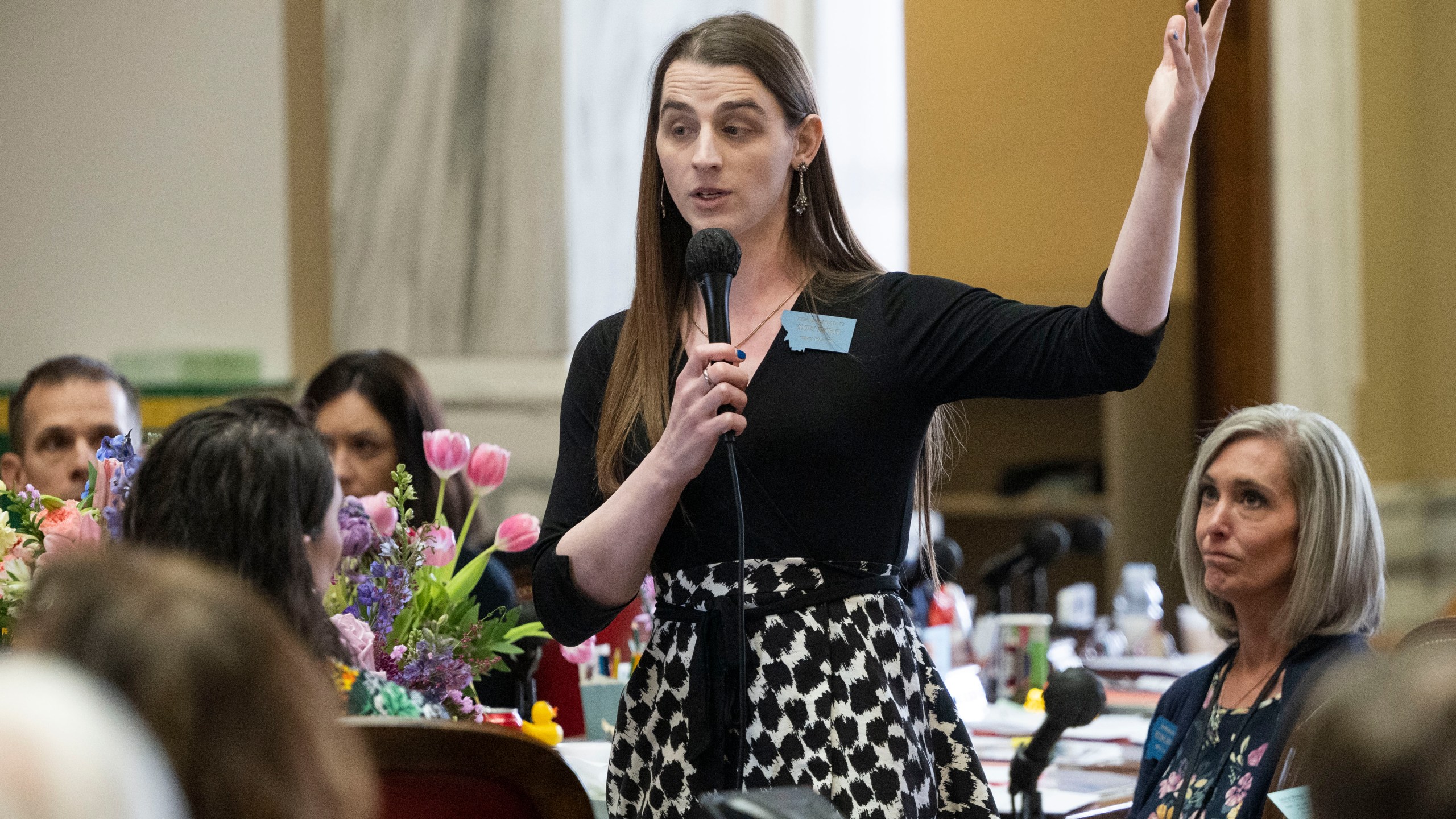 Zooey Zephyr speaks on the House floor for the first time in a week during a session at the Montana State Capitol in Helena, Mont., on Wednesday, April 26, 2023. Lawmakers and courts are wrestling with whether to ban gender-affirming care for minors in some states, while lawmakers in others are protecting access. (AP Photo/Tommy Martino)