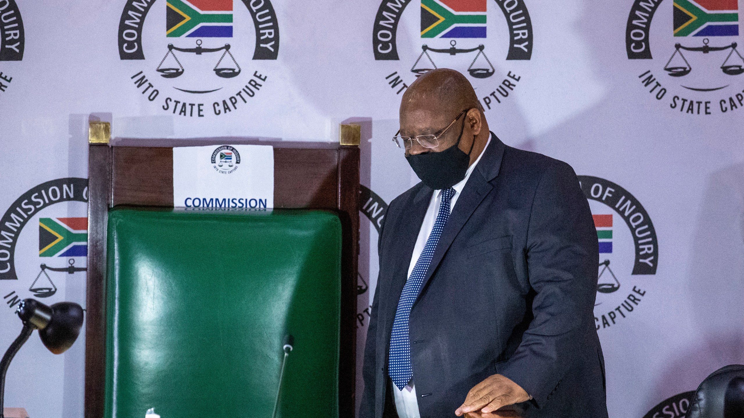 FILE - Judge Raymond Zondo, chairman of the Zondo Commission, a judicial inquiry into government and other high-level corruption in South Africa from 2009-2018 arrives in court, in Johannesburg, South Africa, on Nov. 19, 2020. Anti-corruption groups in South Africa have called for more protection of whistleblowers following recent killings that bore the hallmarks of professional hits. (AP Photo/Themba Hadebe, File)