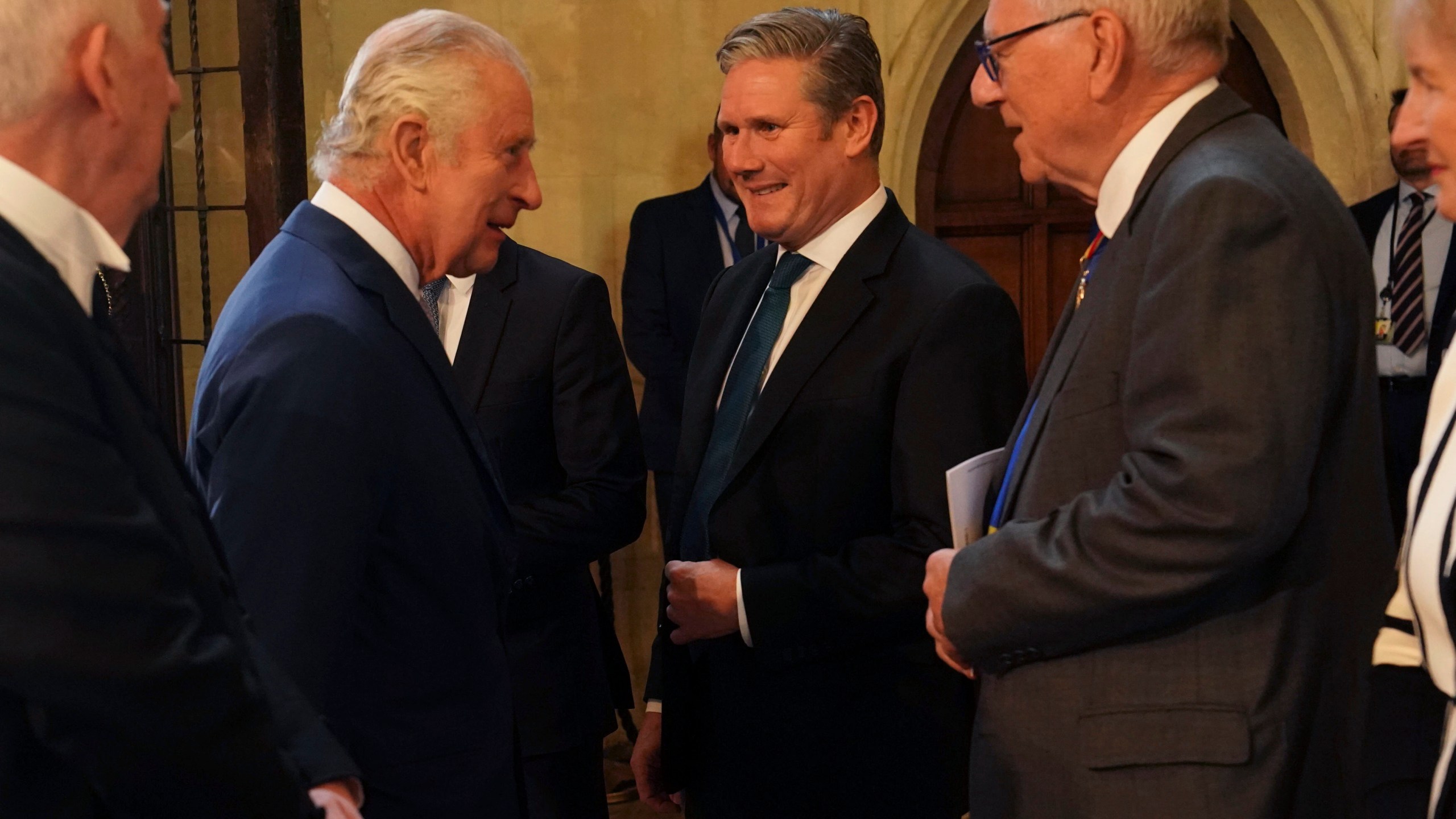 Britain's King Charles III, second left, speaks with Labour leader Keir Starmer, during a visit to Westminster Hall at the Palace of Westminster to attend a reception ahead of the coronation, in London, Tuesday May 2, 2023. (Arthur Edwards/Pool Photo via AP)