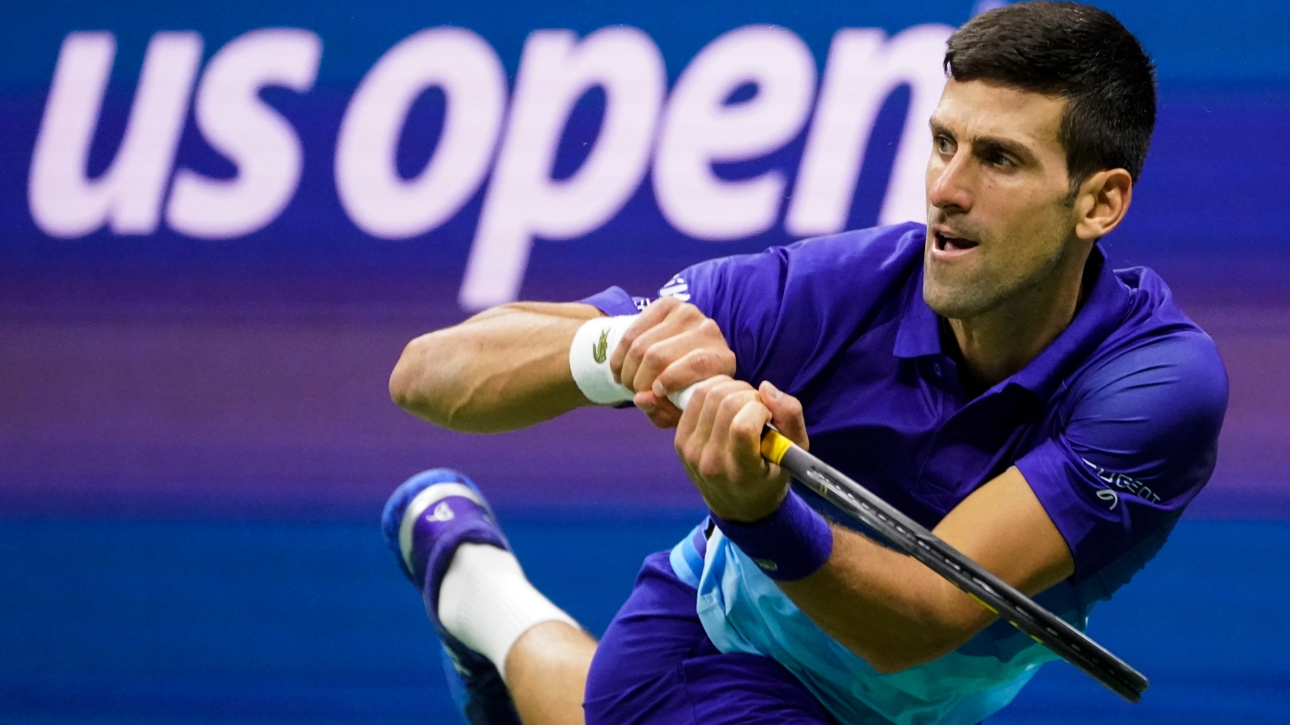 FILE - Novak Djokovic, of Serbia, returns a shot to Alexander Zverev, of Germany, during the semifinals of the U.S. Open tennis championships, Friday, Sept. 10, 2021, in New York. Djokovic can return to the U.S. Open this year after missing the tournament in 2022, because the federal government's COVID-19 vaccination mandate for foreign air travelers will be gone as of next week. (AP Photo/John Minchillo, File)